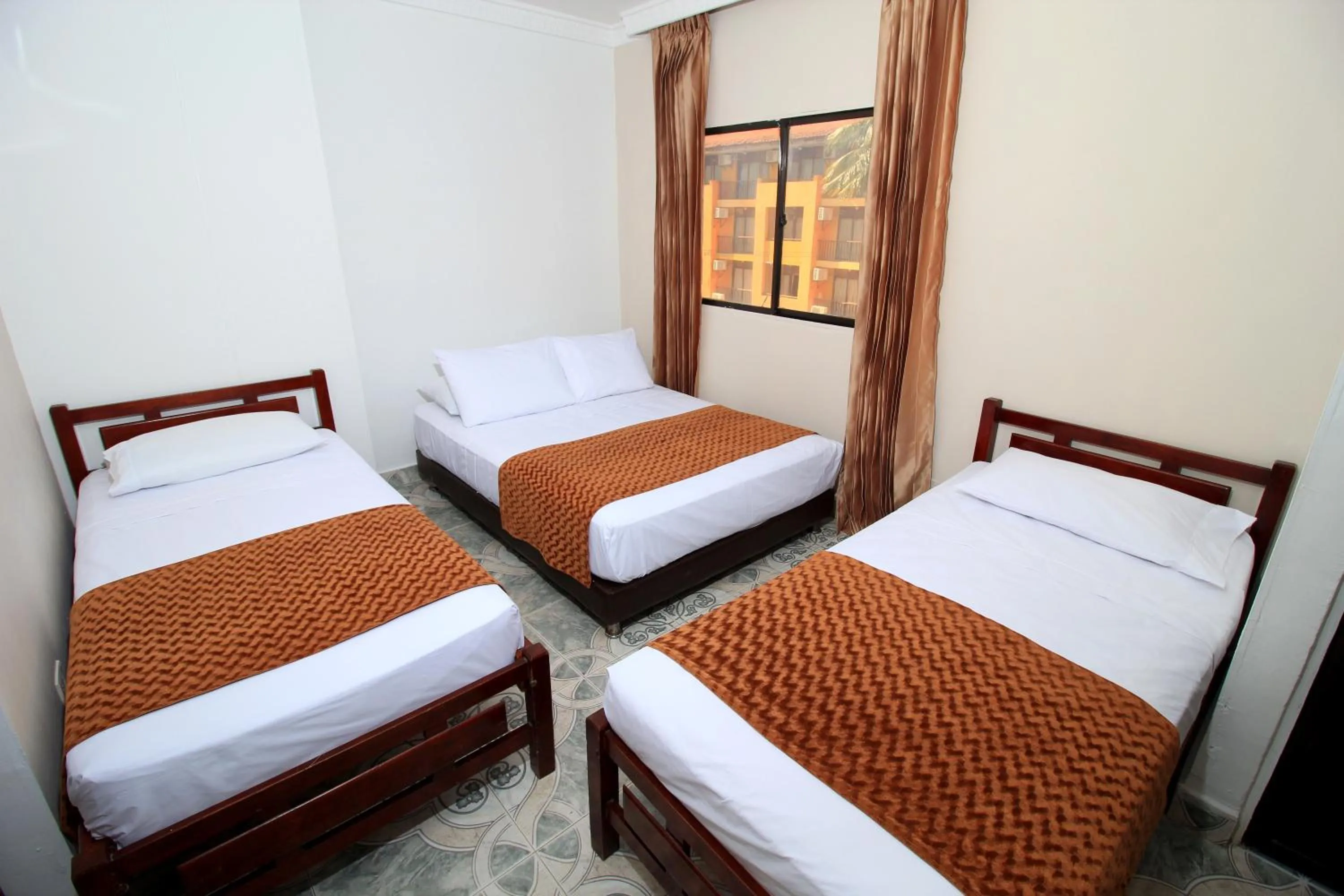 Bedroom, Bed in Hotel Rodadero Inn By GEH Suites