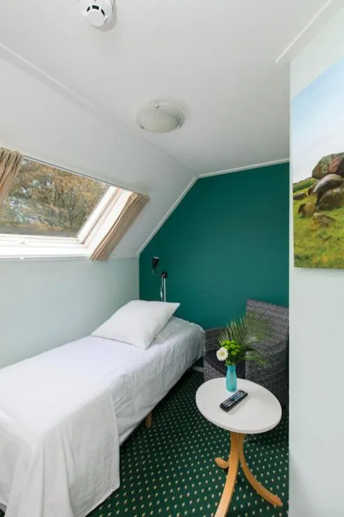 Bed in De Herberg van Anderen