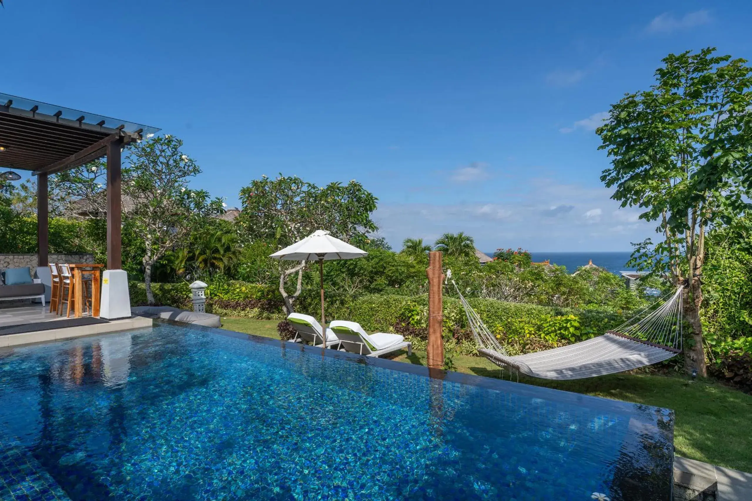 Swimming pool in Samabe Bali Suites & Villas Swimming pool in Samabe Bali Suites & Villas