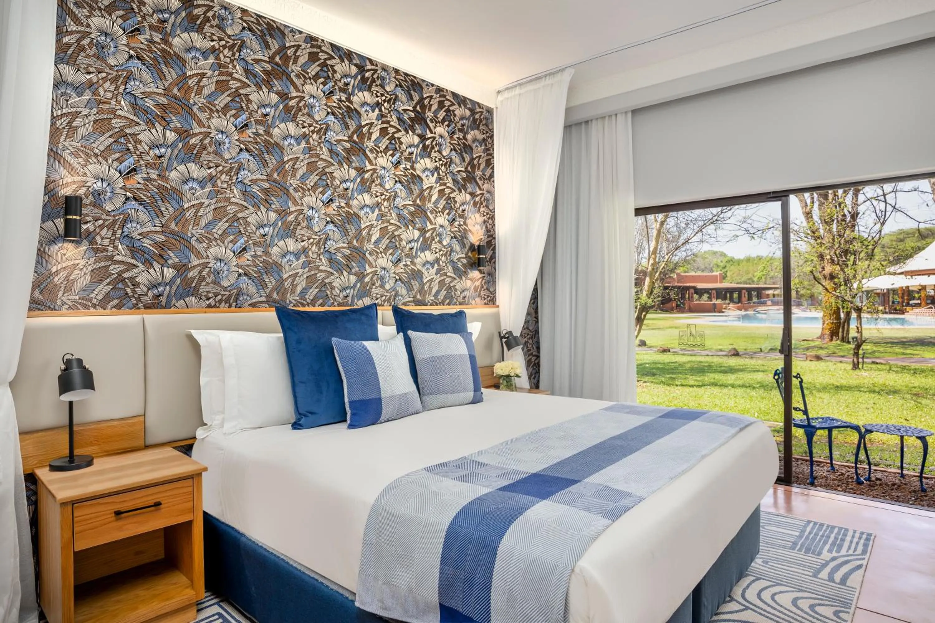 Bed in Avani Victoria Falls Resort