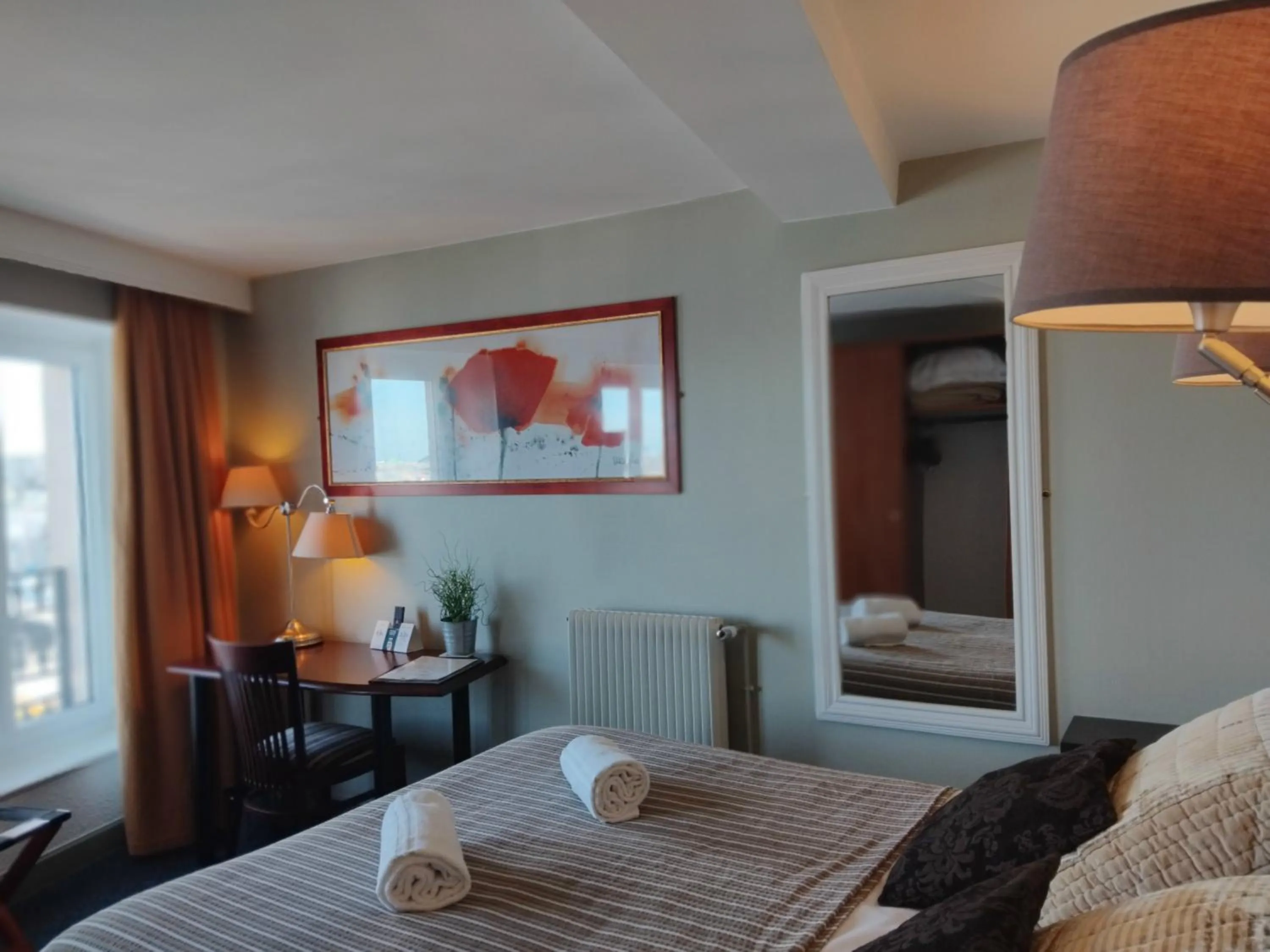 Bed in Logis HOTEL RESTAURANT La Régence