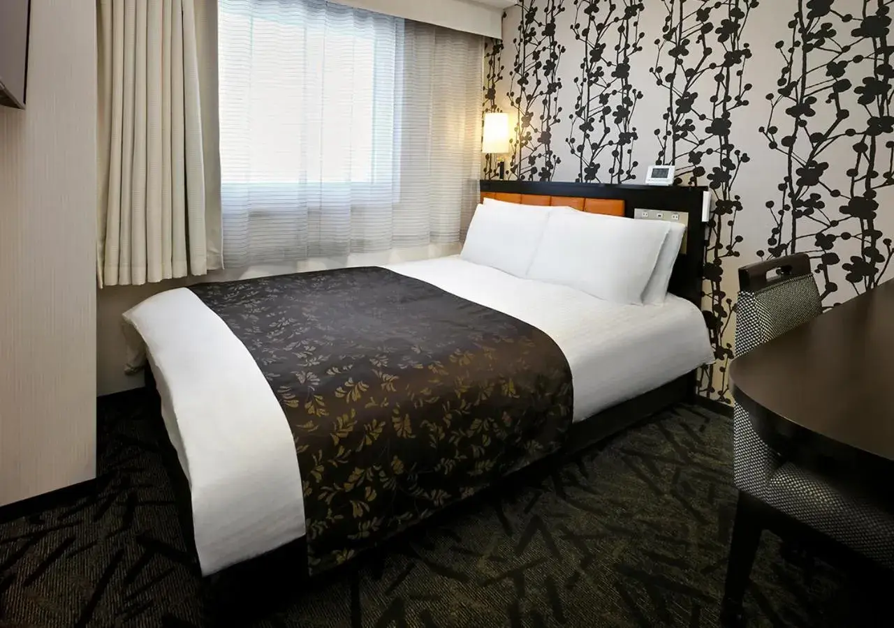 Bed in APA Hotel Saitama Higashimatsuyama Ekimae Bed in APA Hotel Saitama Higashimatsuyama Ekimae