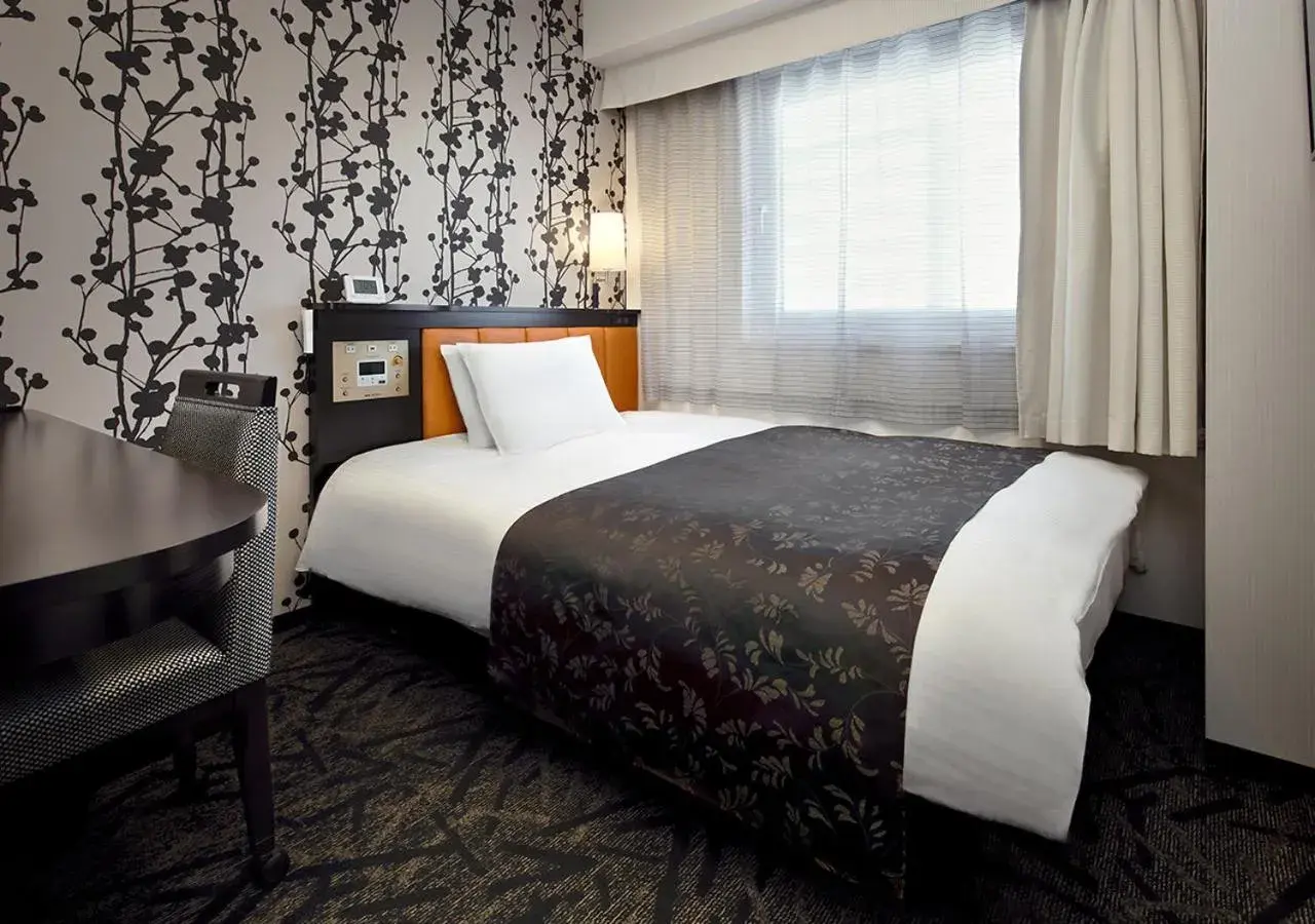 Bed in APA Hotel Saitama Higashimatsuyama Ekimae Bed in APA Hotel Saitama Higashimatsuyama Ekimae