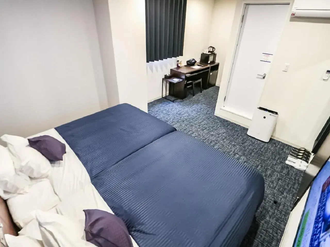 Bed in HOTEL LiVEMAX BUDGET Fuji Ekimae Bed in HOTEL LiVEMAX BUDGET Fuji Ekimae