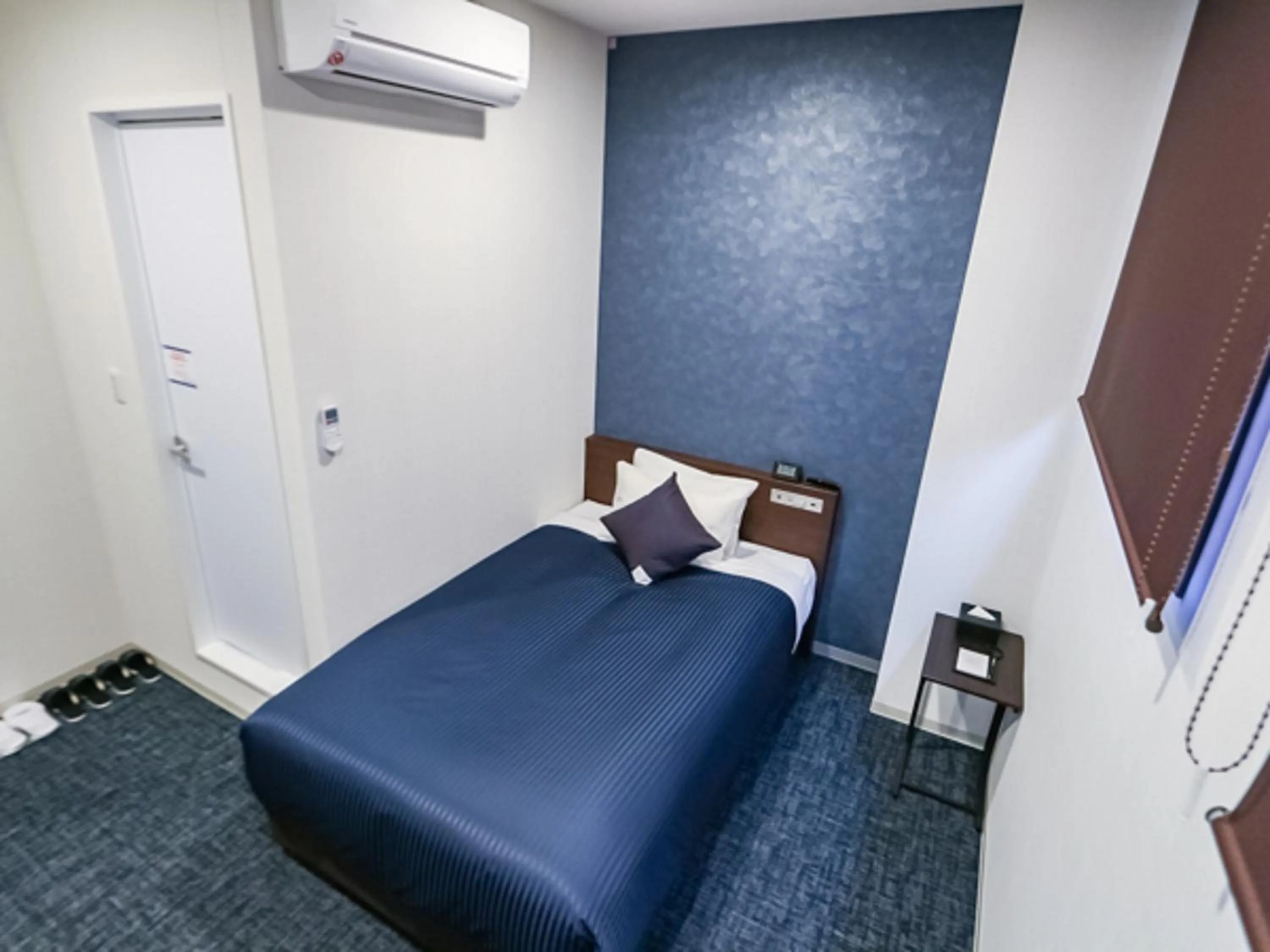 Bed in HOTEL LiVEMAX BUDGET Fuji Ekimae