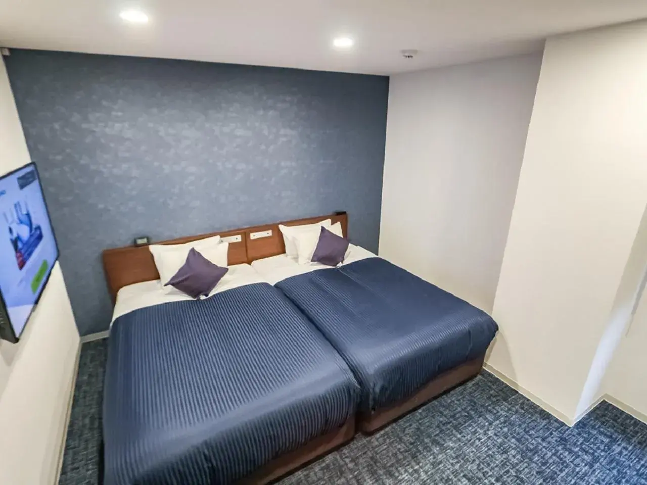 Bed in HOTEL LiVEMAX BUDGET Fuji Ekimae Bed in HOTEL LiVEMAX BUDGET Fuji Ekimae