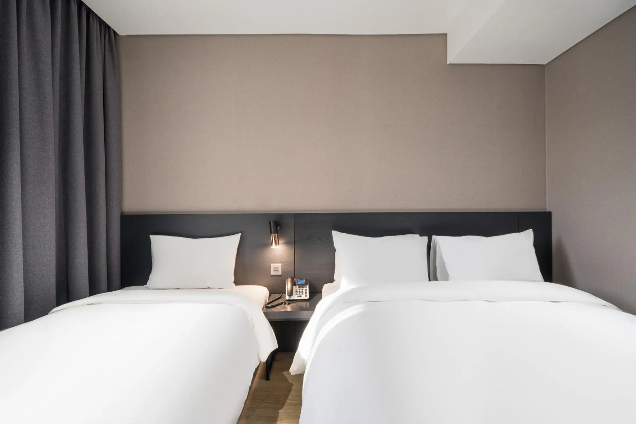 Bed in Rivertain Hotel Gyeongju