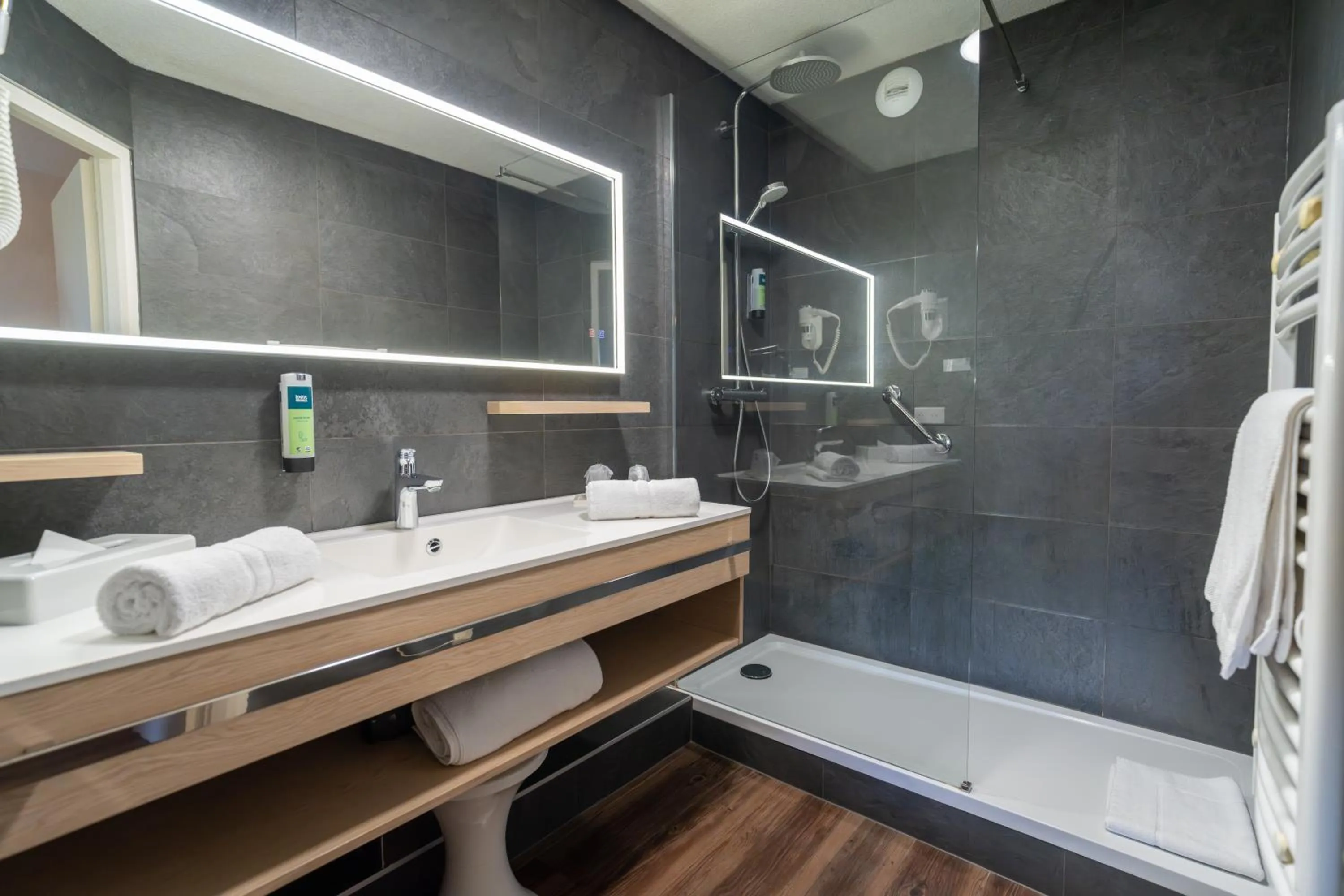 Shower in Logis Hotel Arc En Ciel