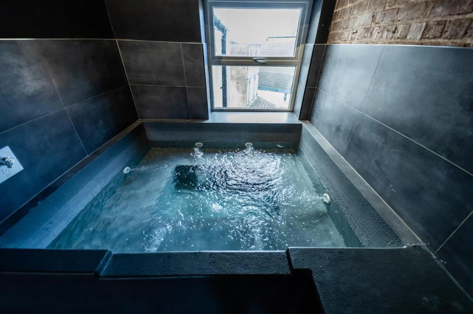 Hot Tub in The Loft Sasco Apartments