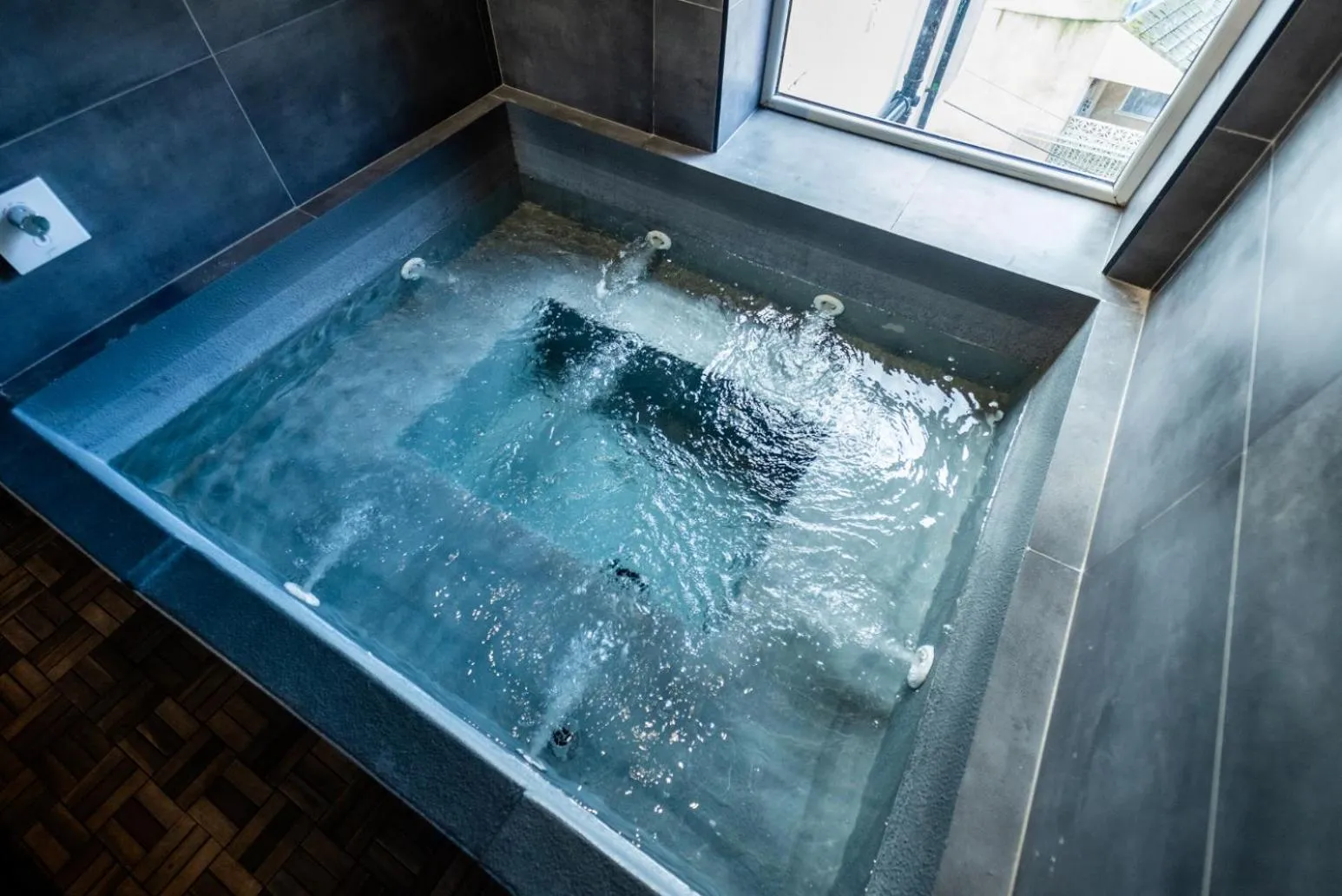 Hot Tub in The Loft Sasco Apartments