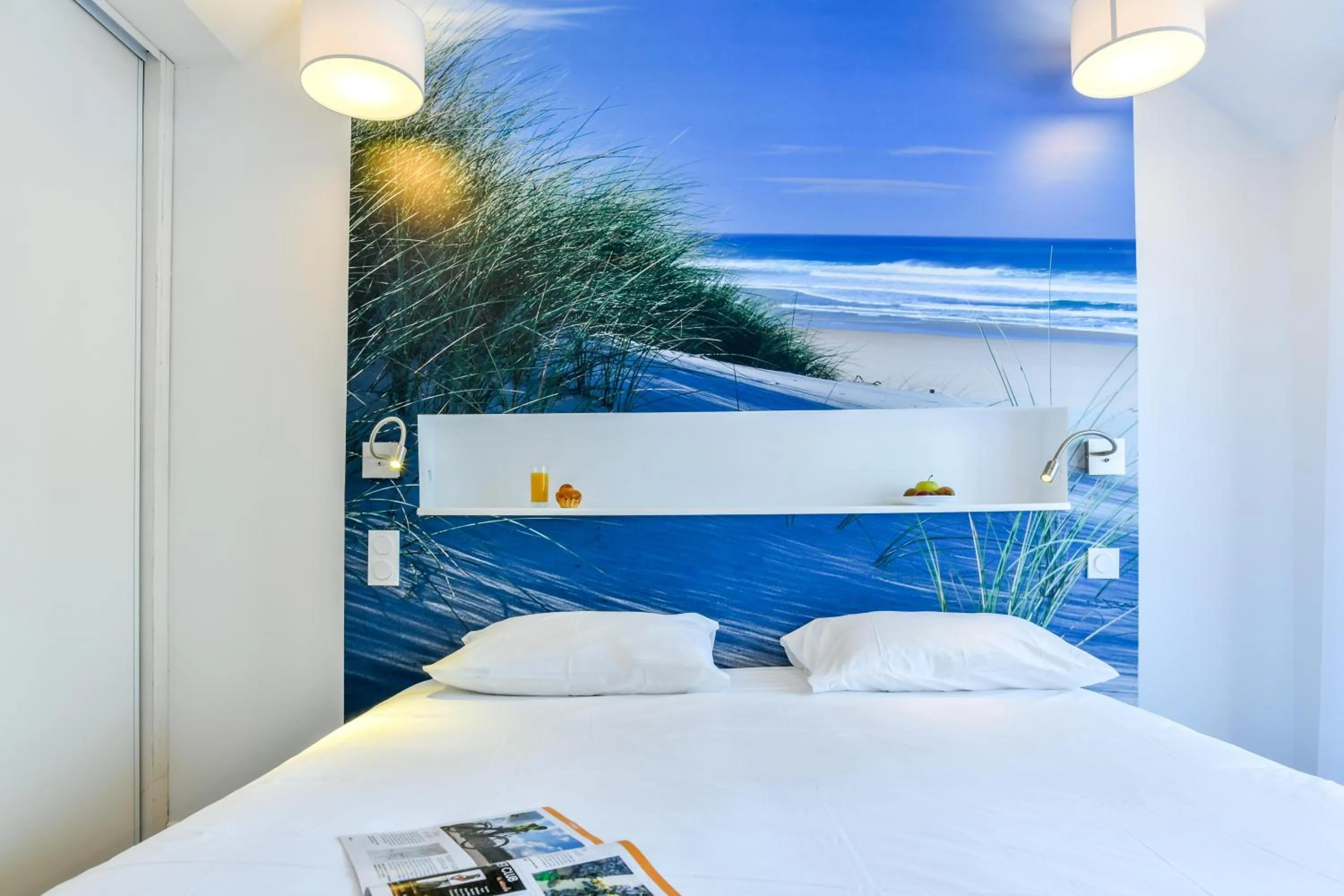 Bed in Les Vagues Hôtel Restaurant