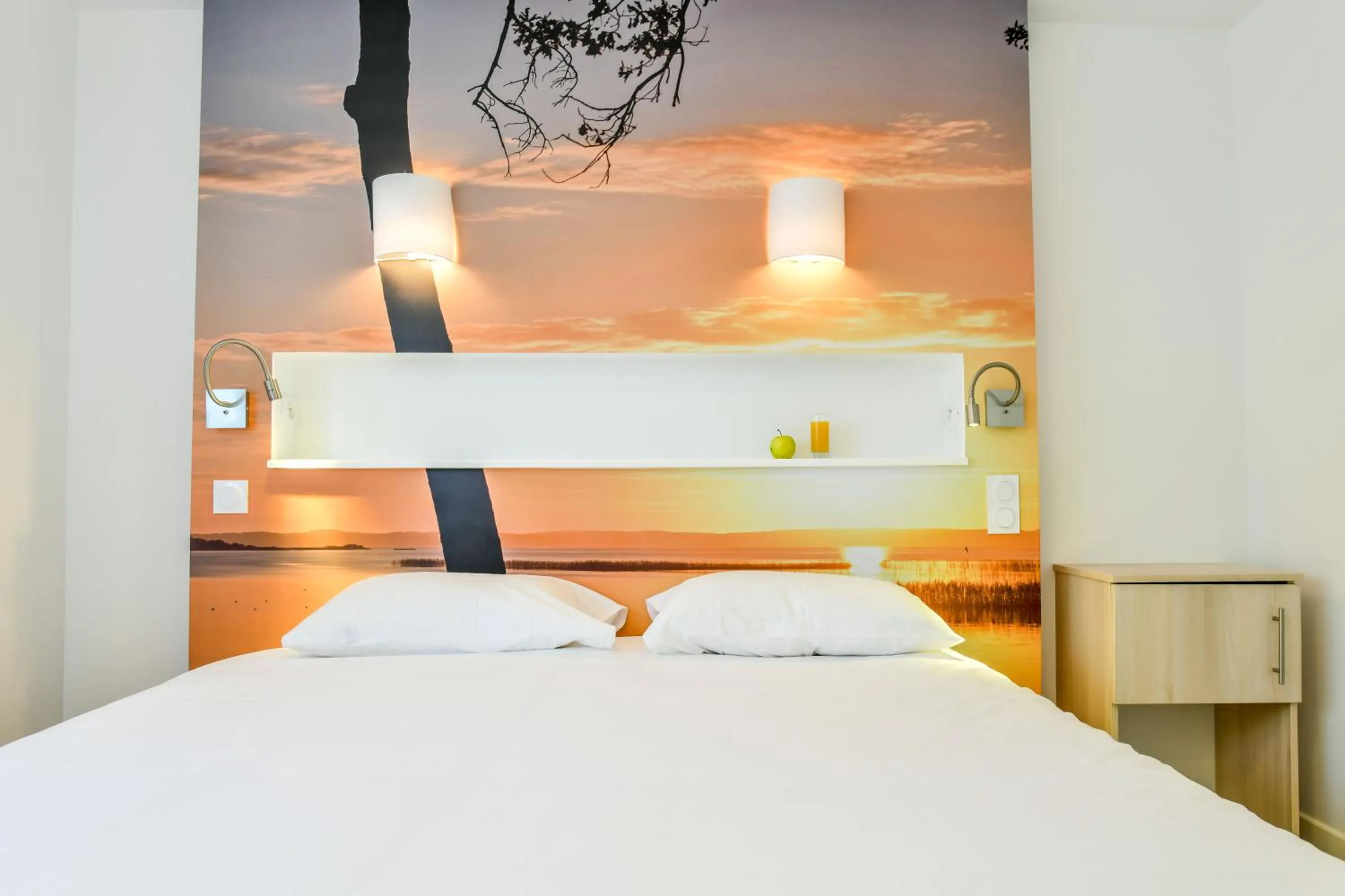 Bed in Les Vagues Hôtel Restaurant