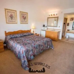 Bed in Bullwinkles Rustic Lodge