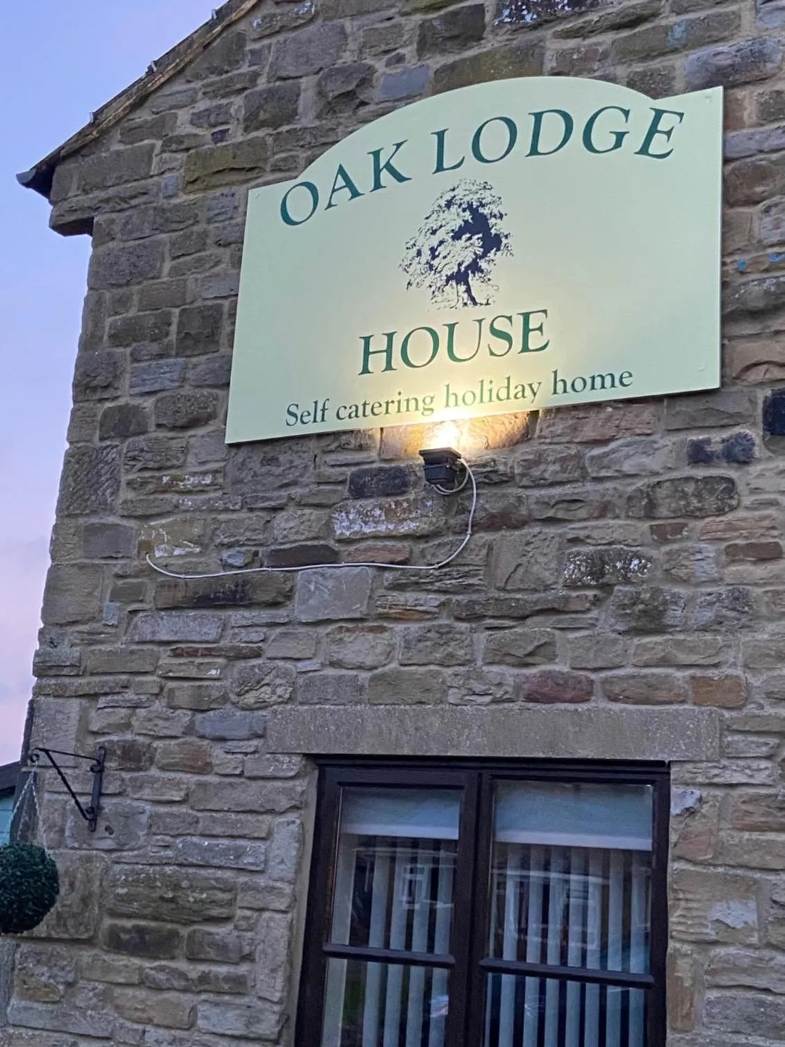 Property logo or sign in Oaklodge House