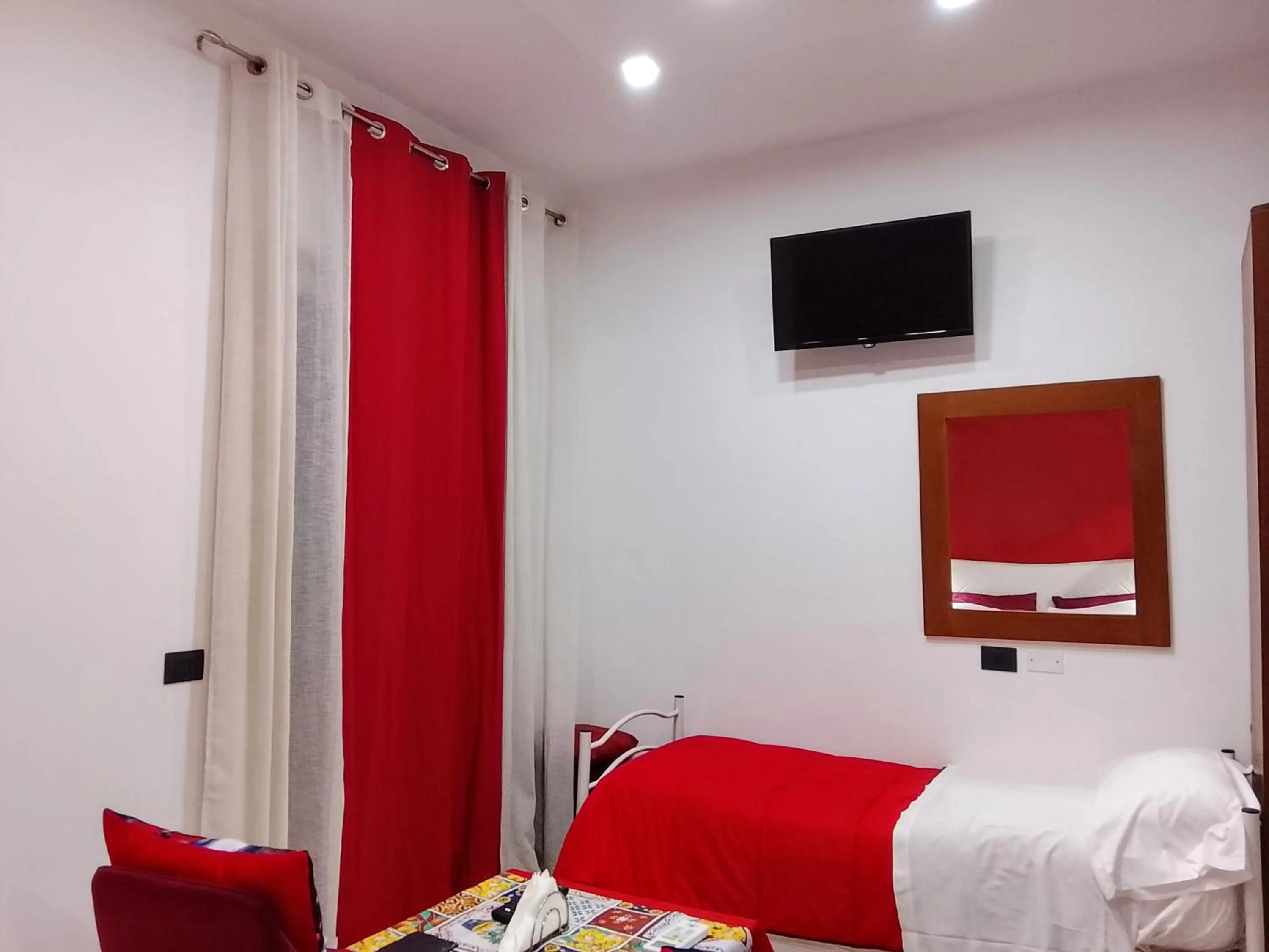 Bed in Domus Michaeli B&B Pompei perfetto per famiglie e gruppi Camere confortevoli vicino agli Scavi e al centro