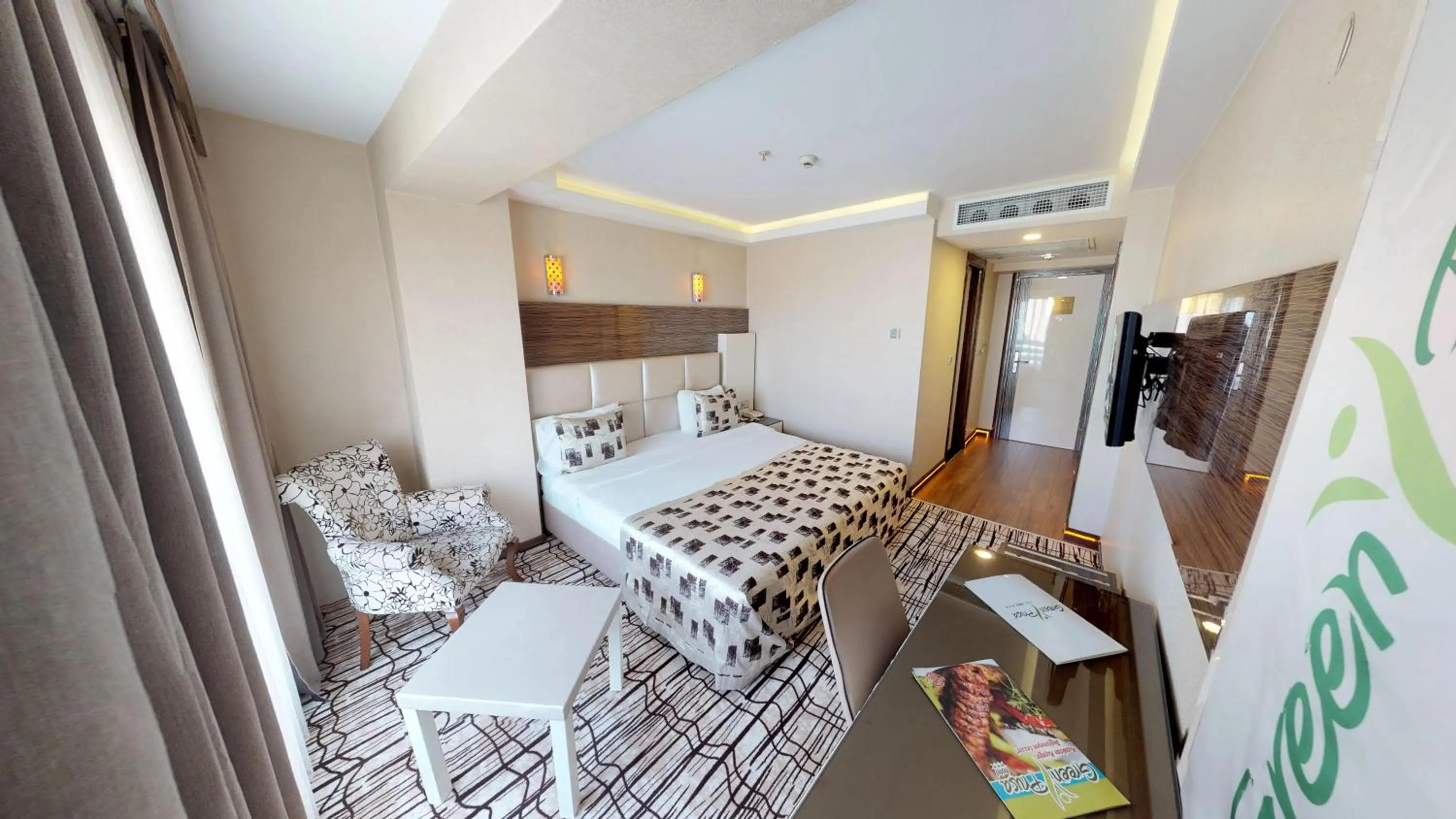 Bed in Green Prusa Hotel