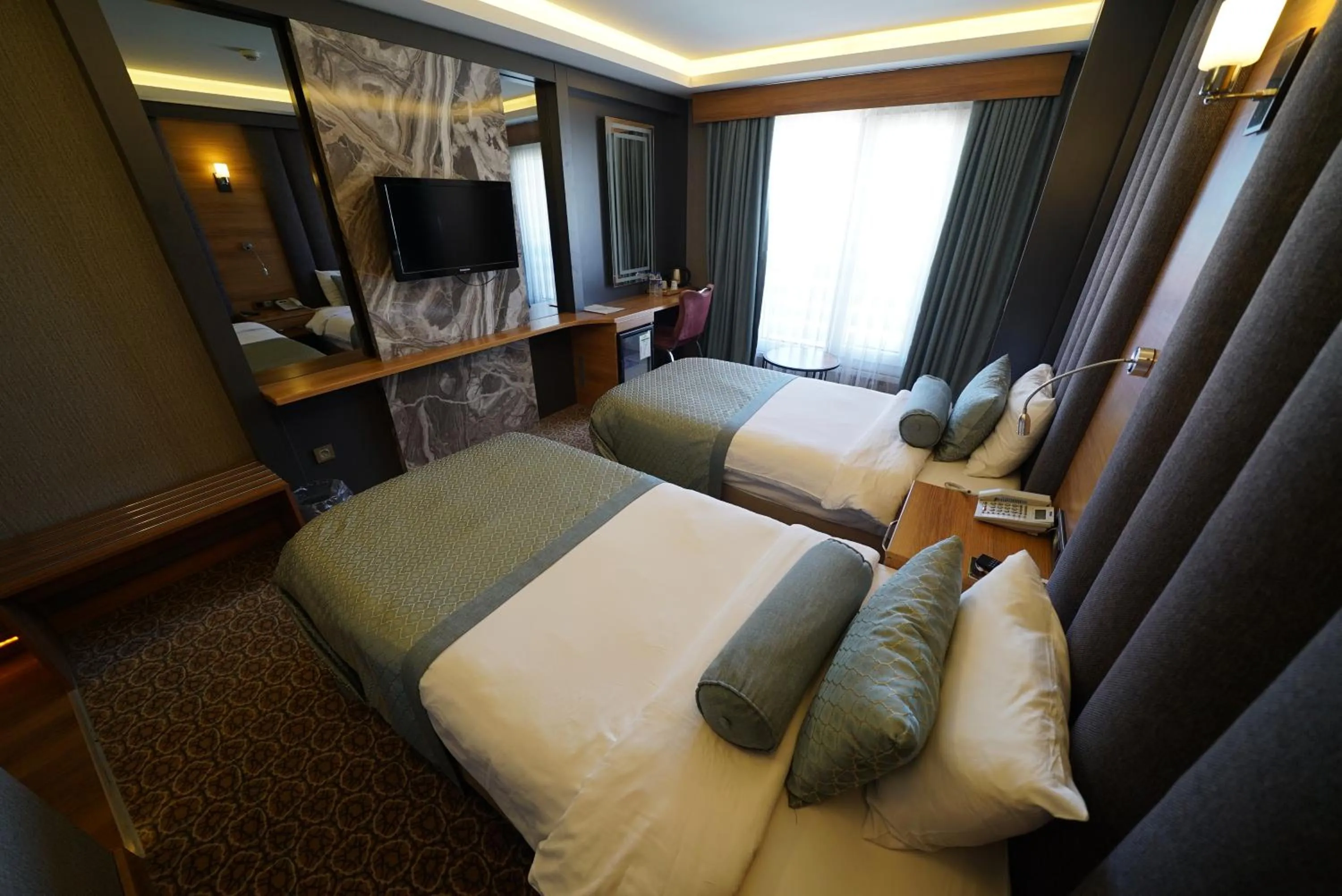 Bed in Green Prusa Hotel