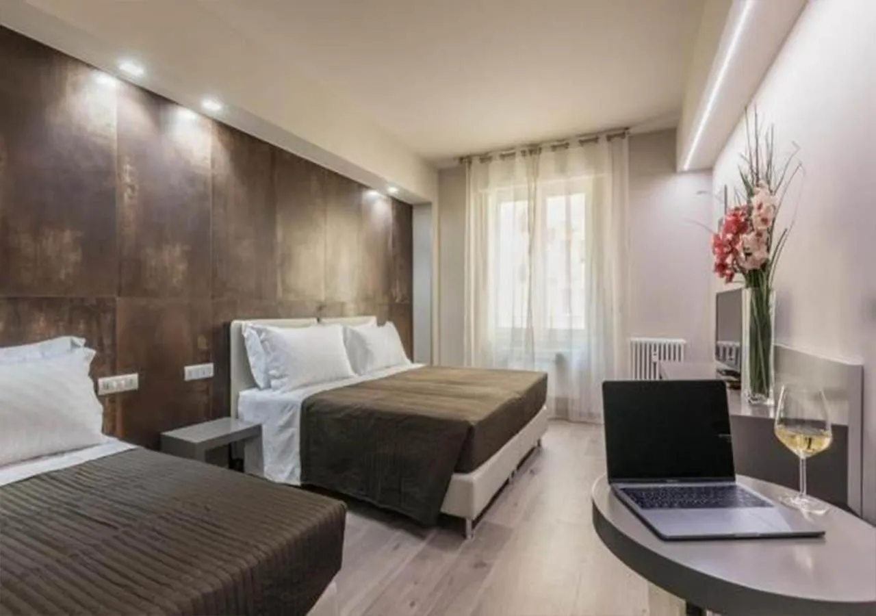 Bed in Astoria Deluxe rooms