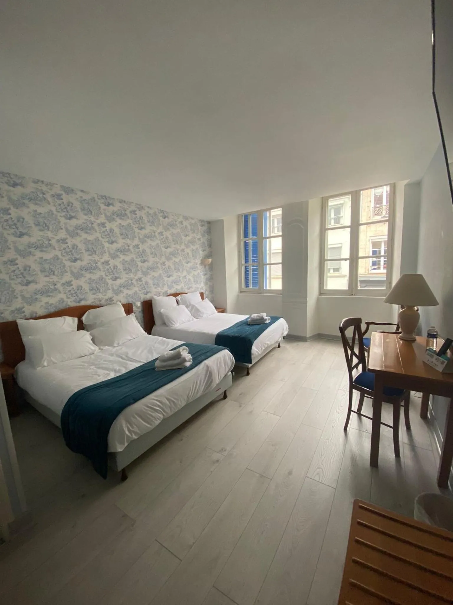 Bed in Logis Grand Hôtel De L'Europe