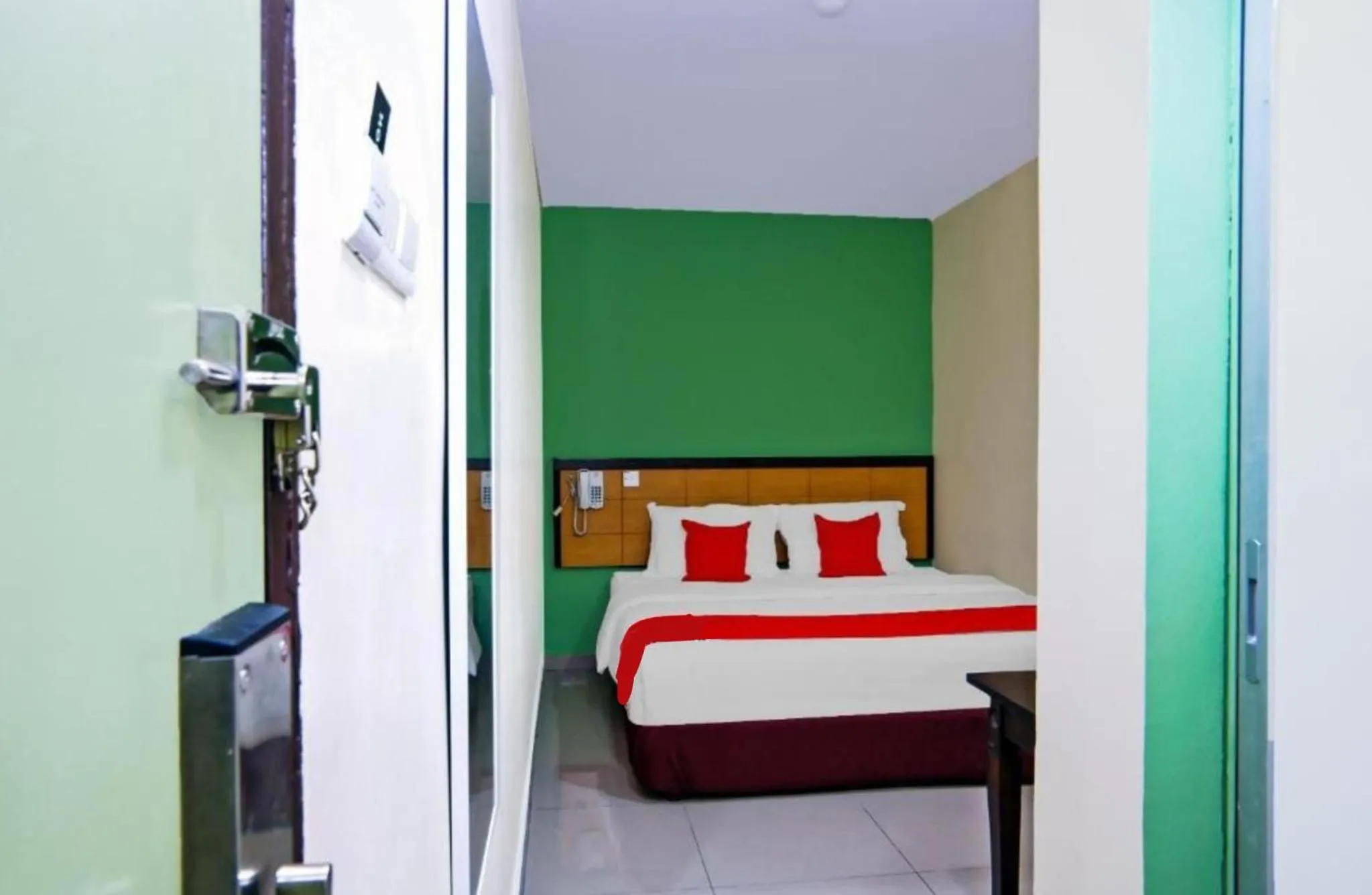 Bed in Holiday Mansion Inn Sibu