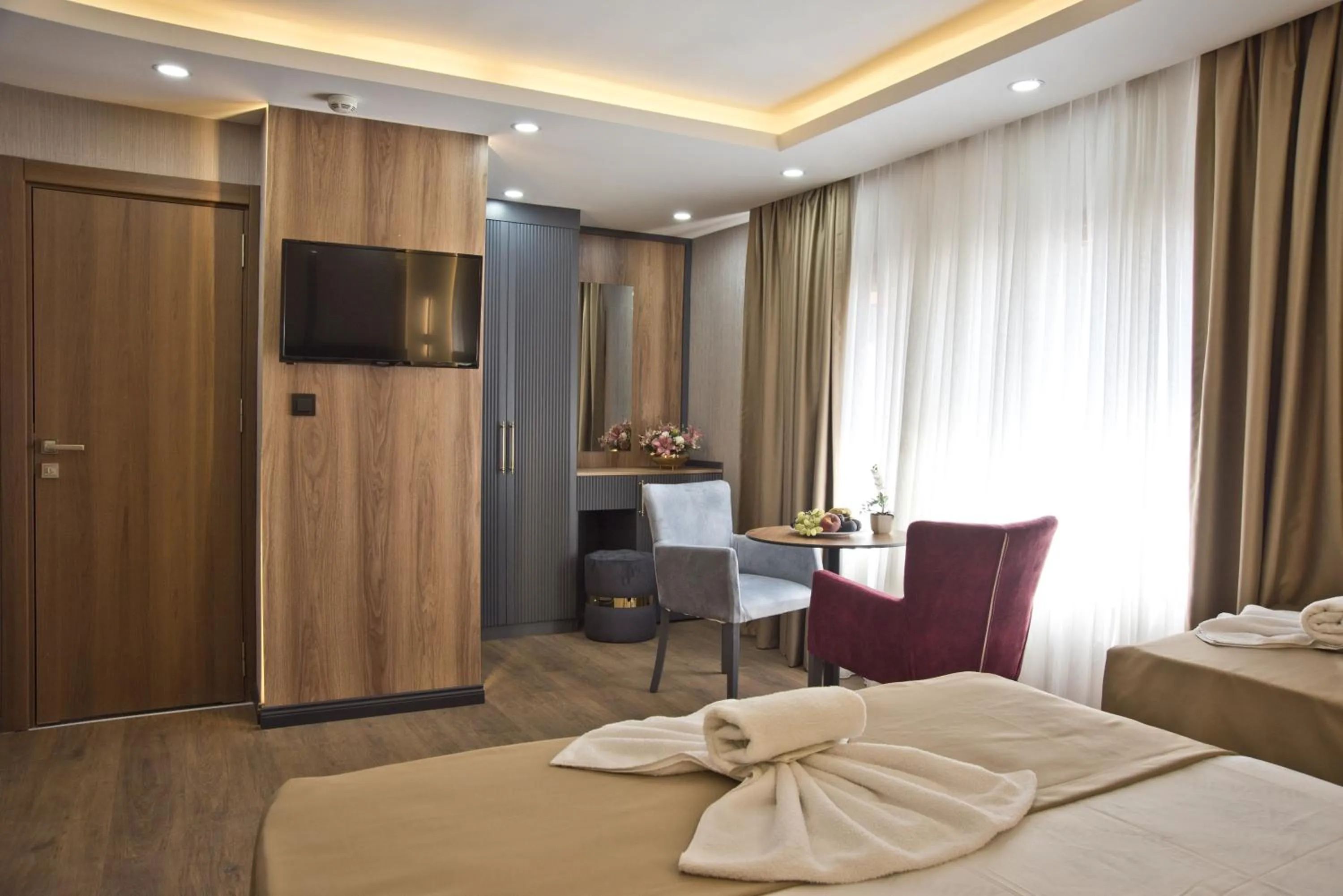 Photo of the whole room, Bed in Grand Bagoz Hotel