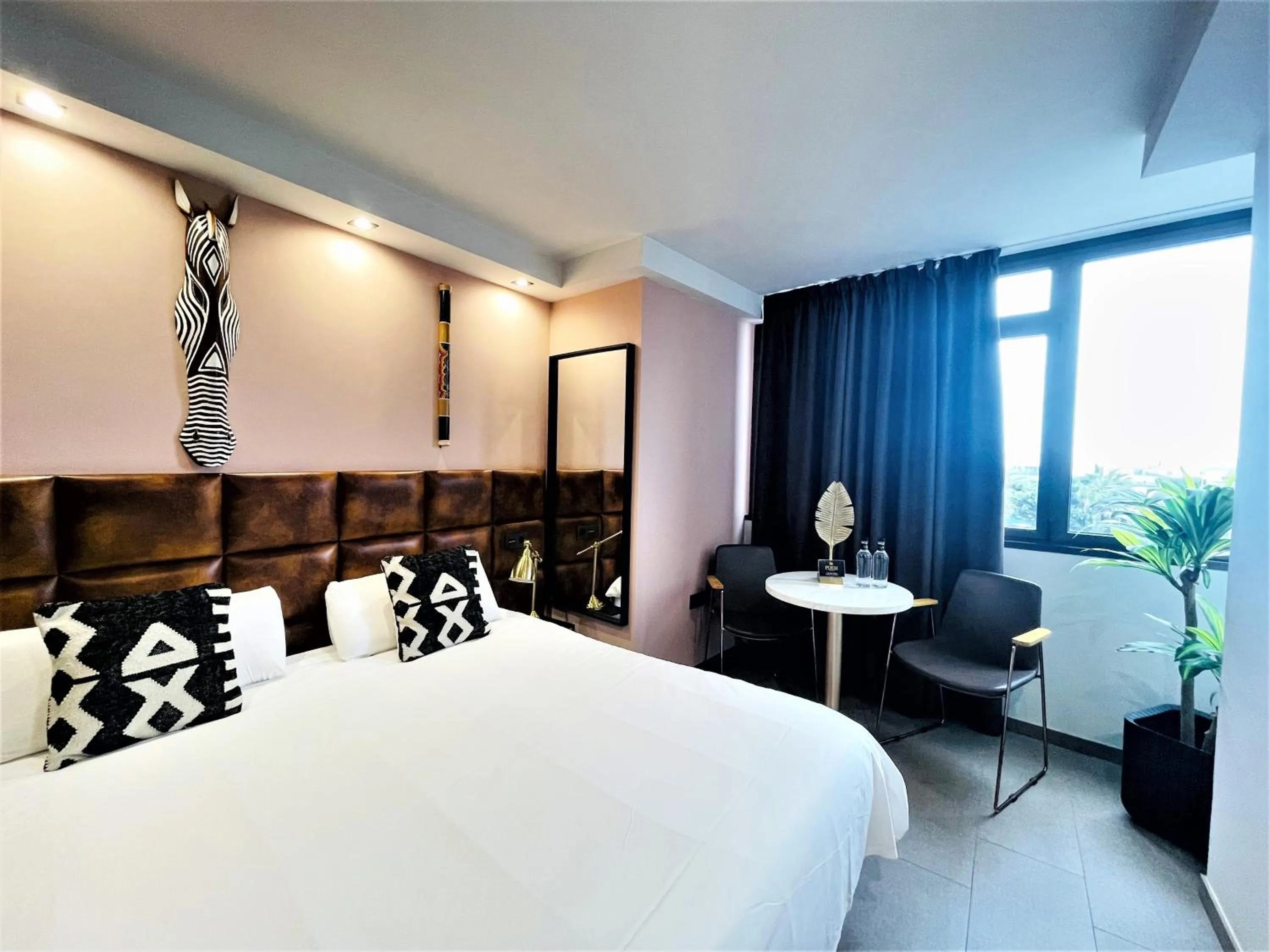 Seating area, Bed in Poem Suites, Las Canteras