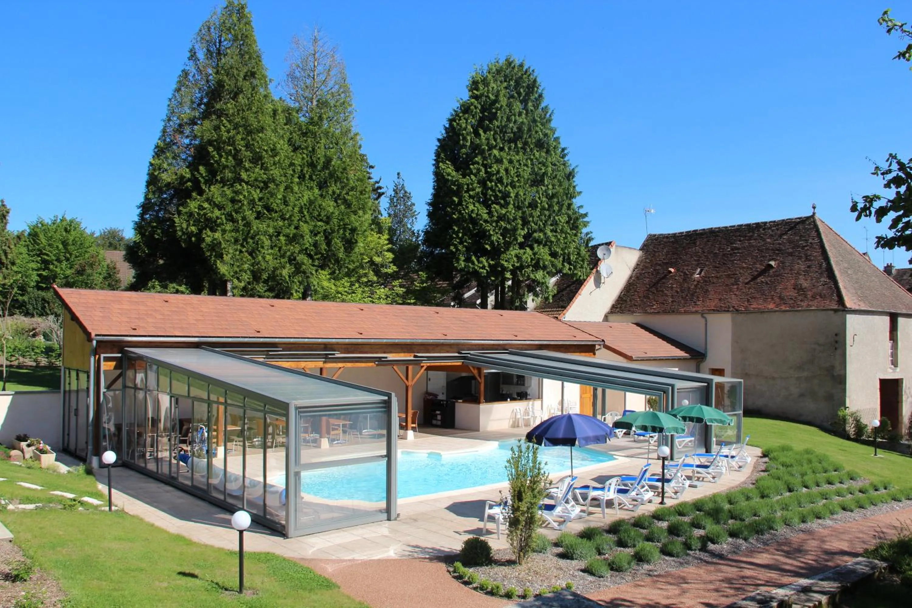 Swimming pool in Logis Des Trois Maures