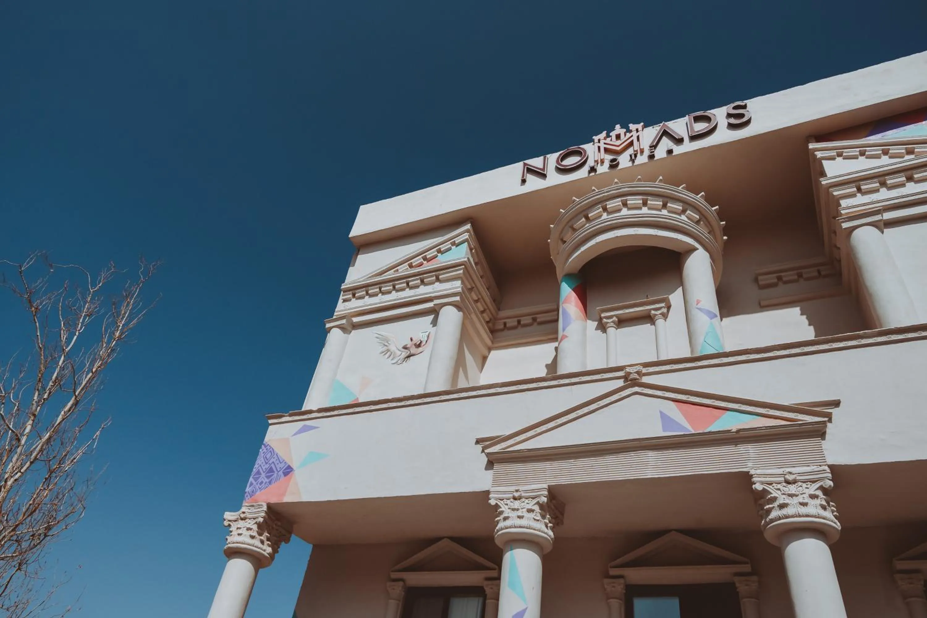 Property logo or sign in Nomads Hotel