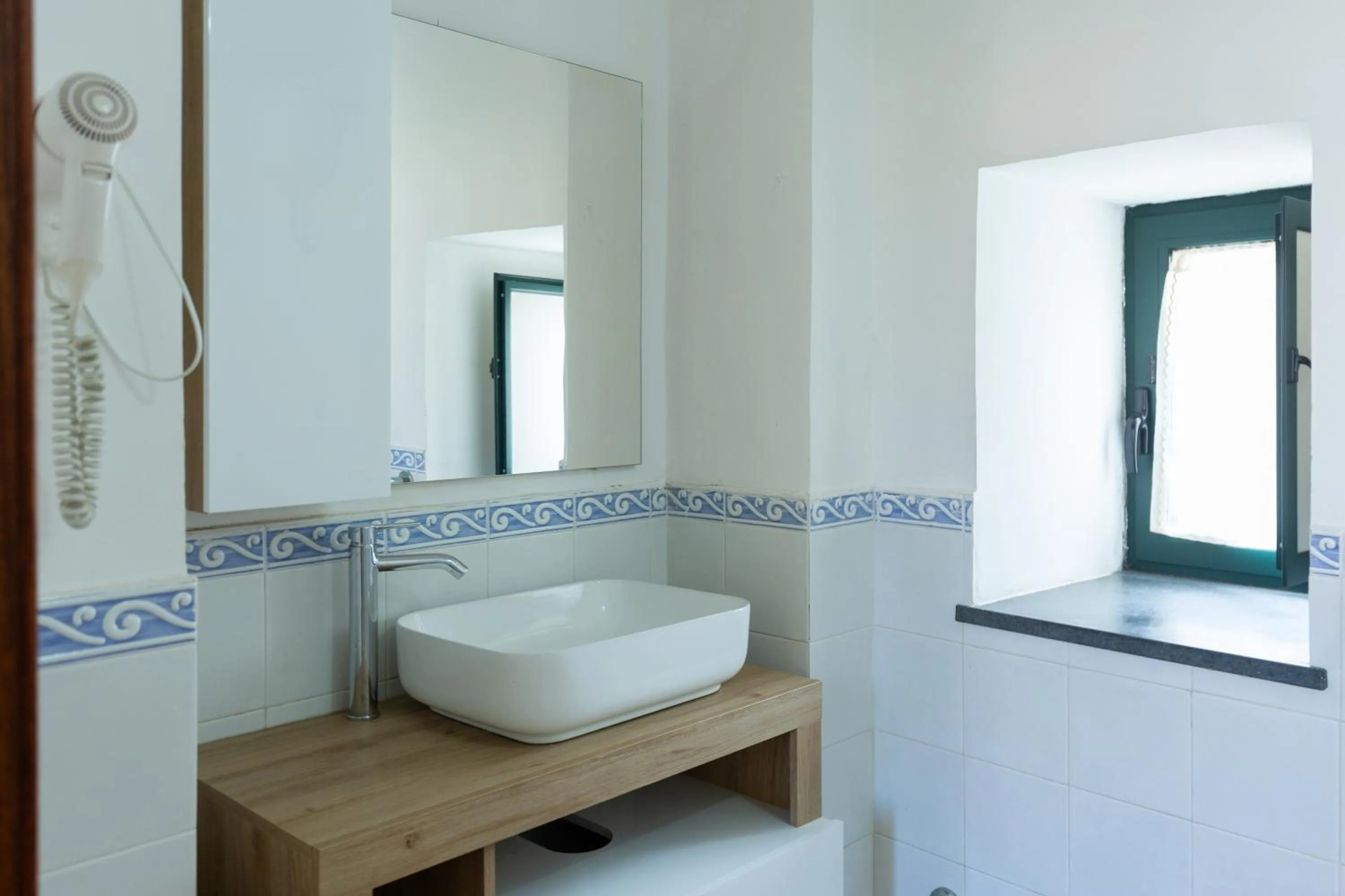 Bathroom in Flowers apartments & rooms