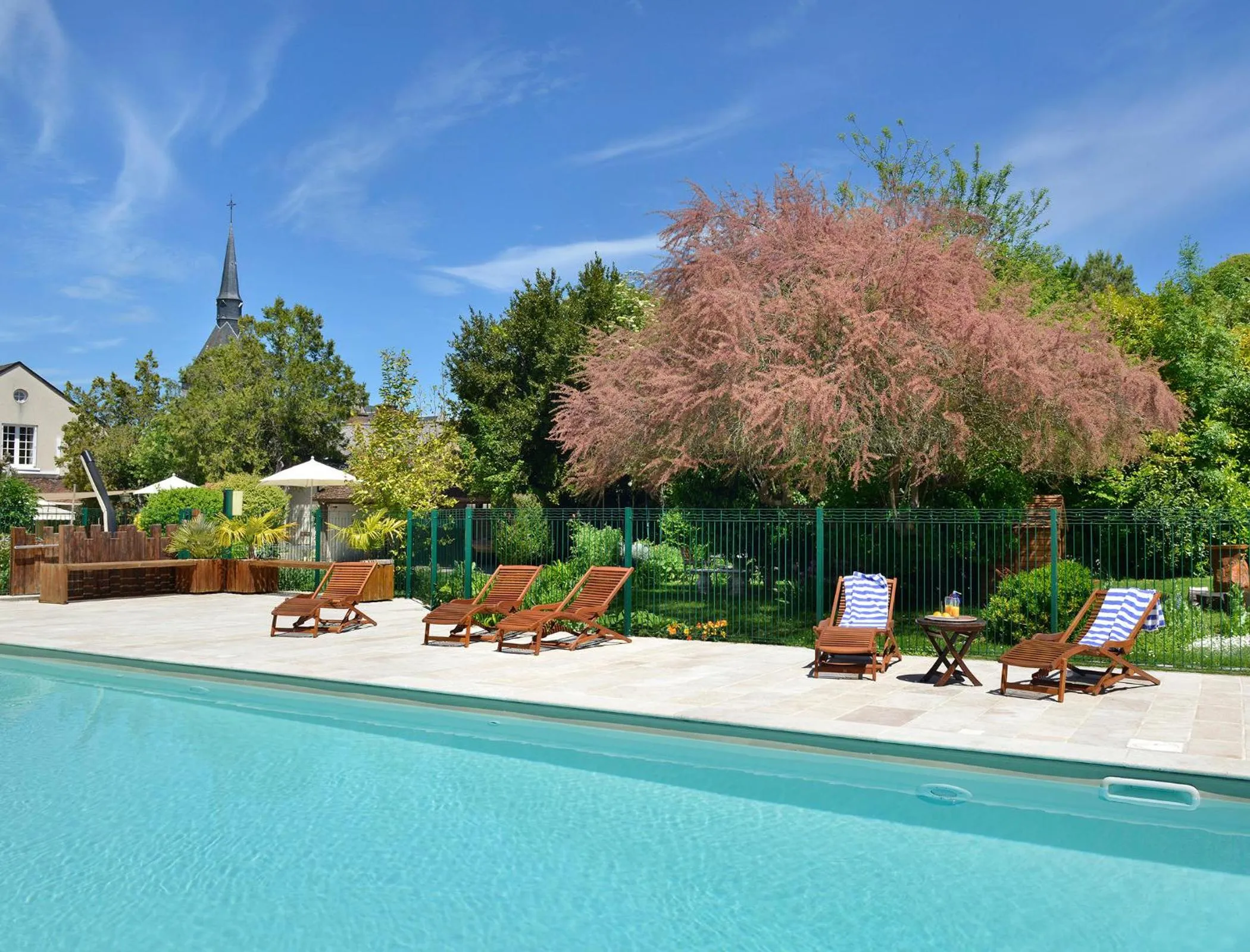 Swimming pool in Logis Auberge Du Centre