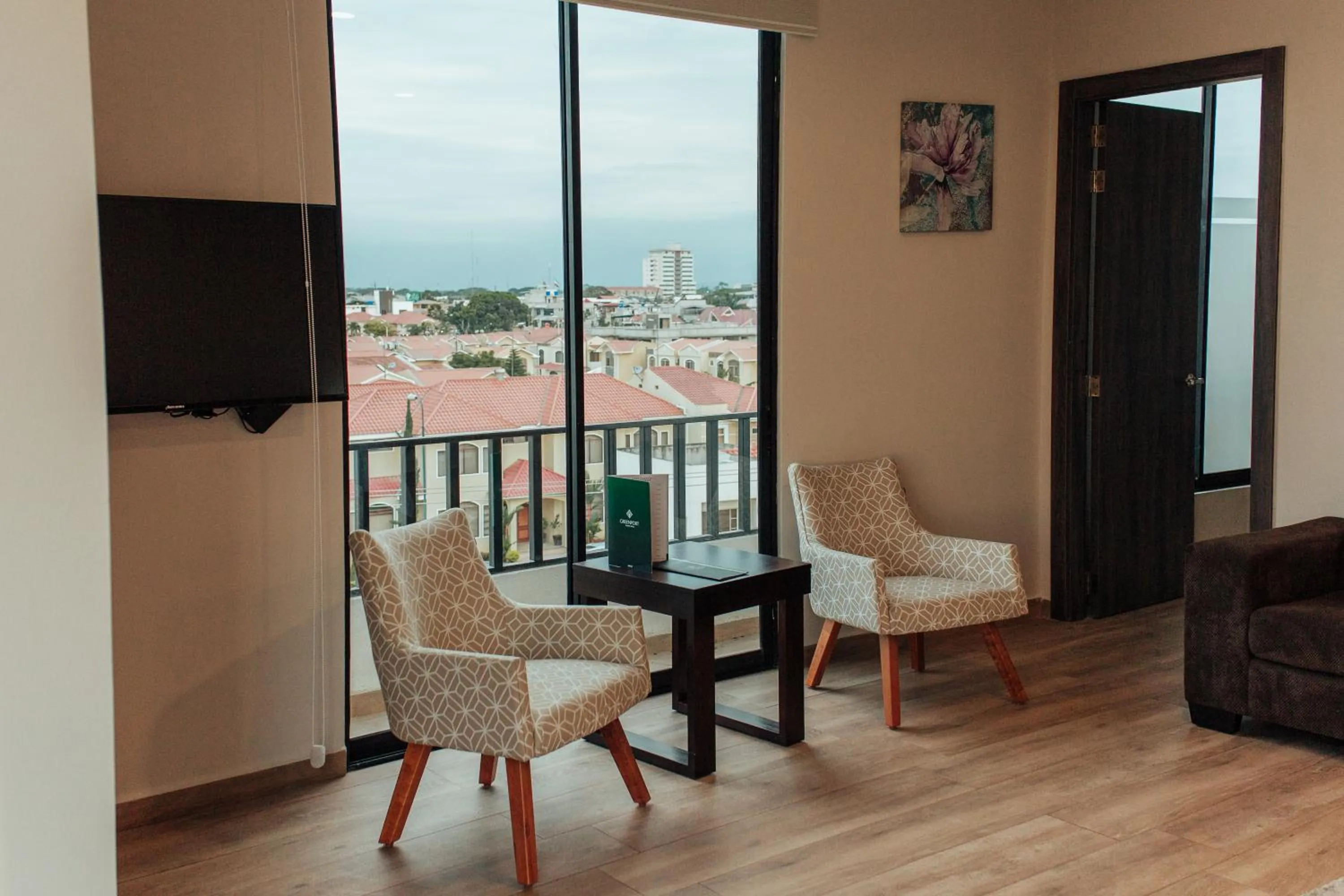 Living room in REEC Machala by Oro Verde Hotels