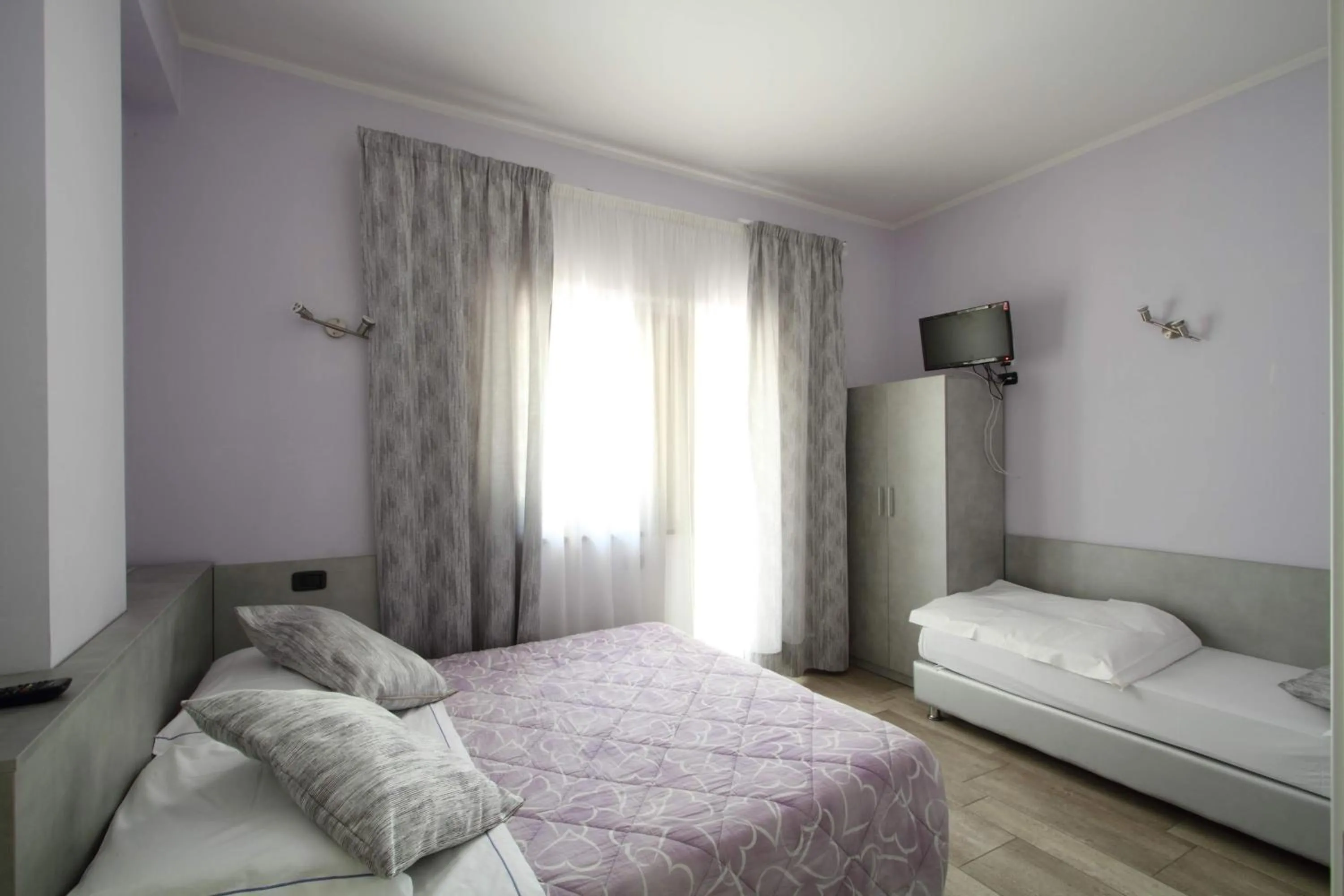 Bed in Il Ruscello Rooms and Luxury Suite