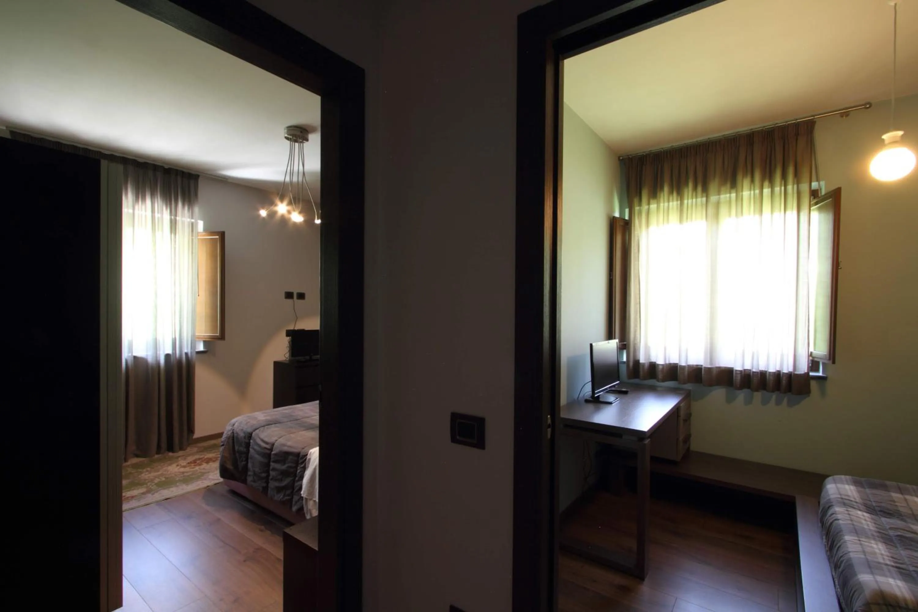 Bed in Il Ruscello Rooms and Luxury Suite
