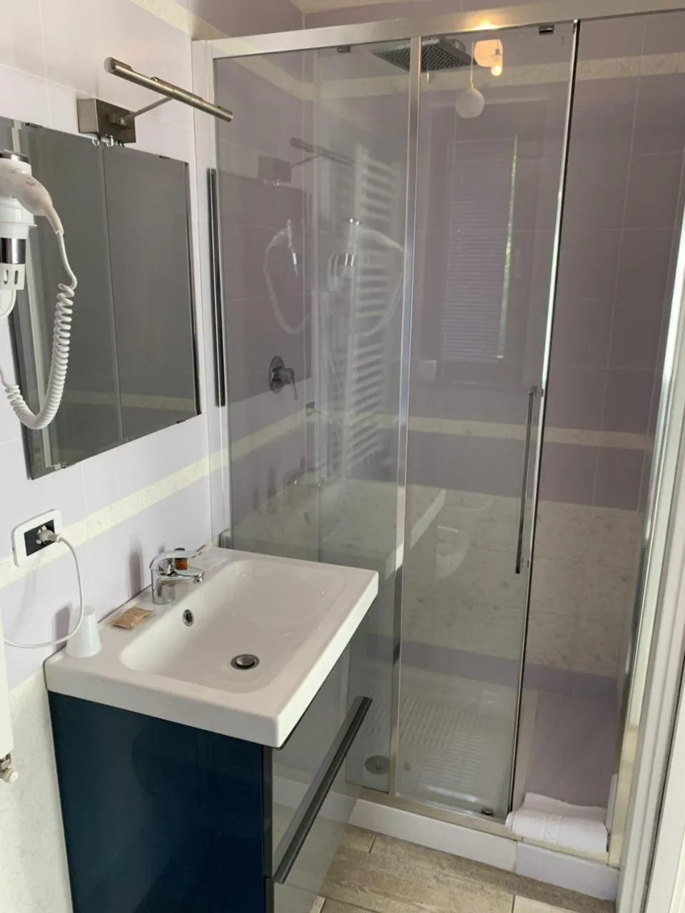 Shower in Il Ruscello Rooms and Luxury Suite