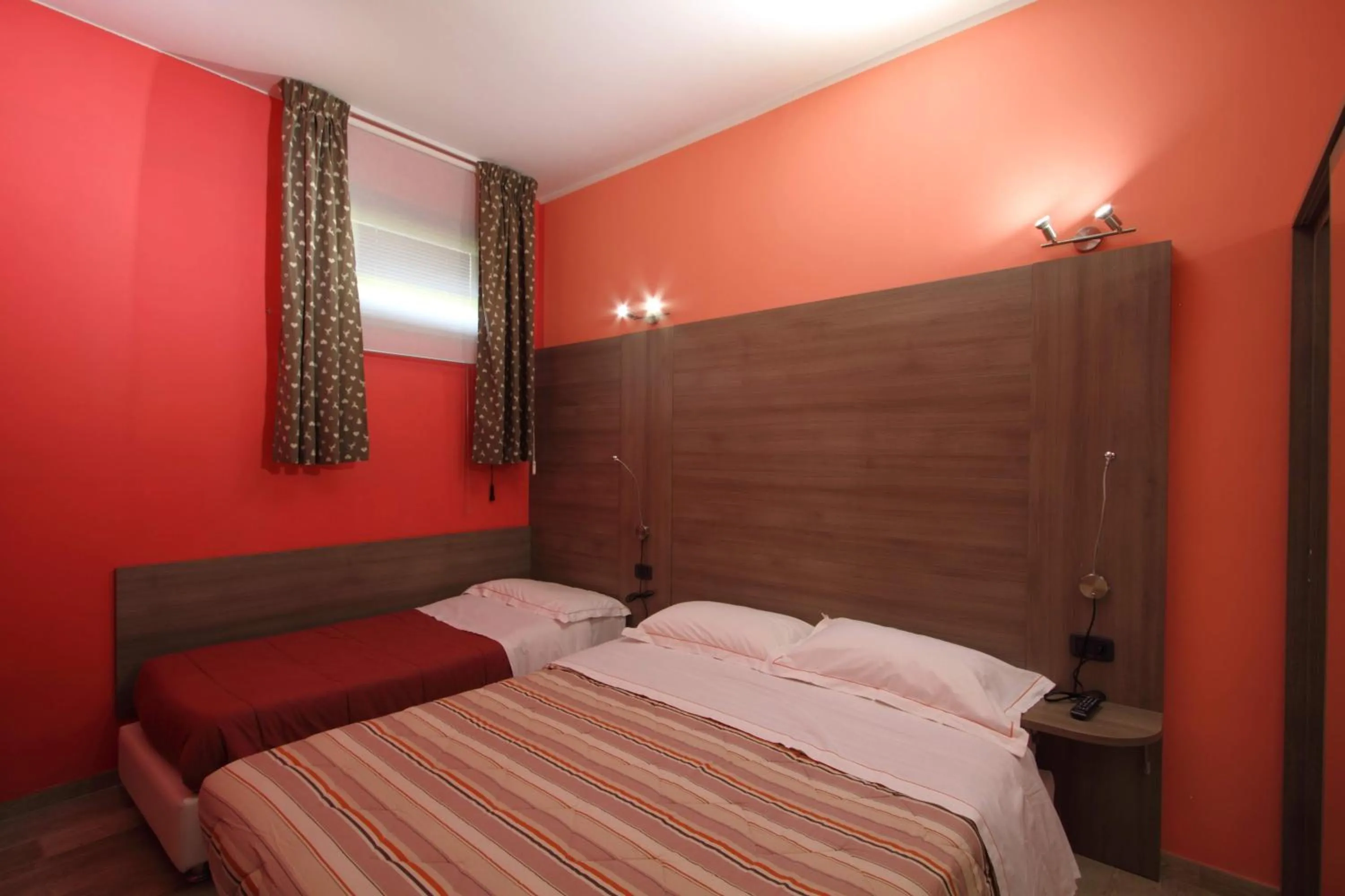 Bed in Il Ruscello Rooms and Luxury Suite
