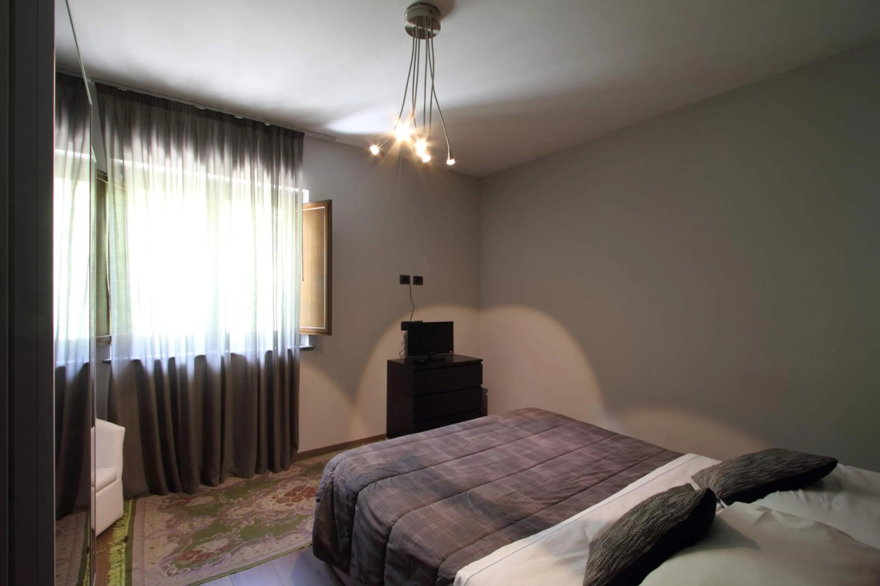 Bed in Il Ruscello Rooms and Luxury Suite