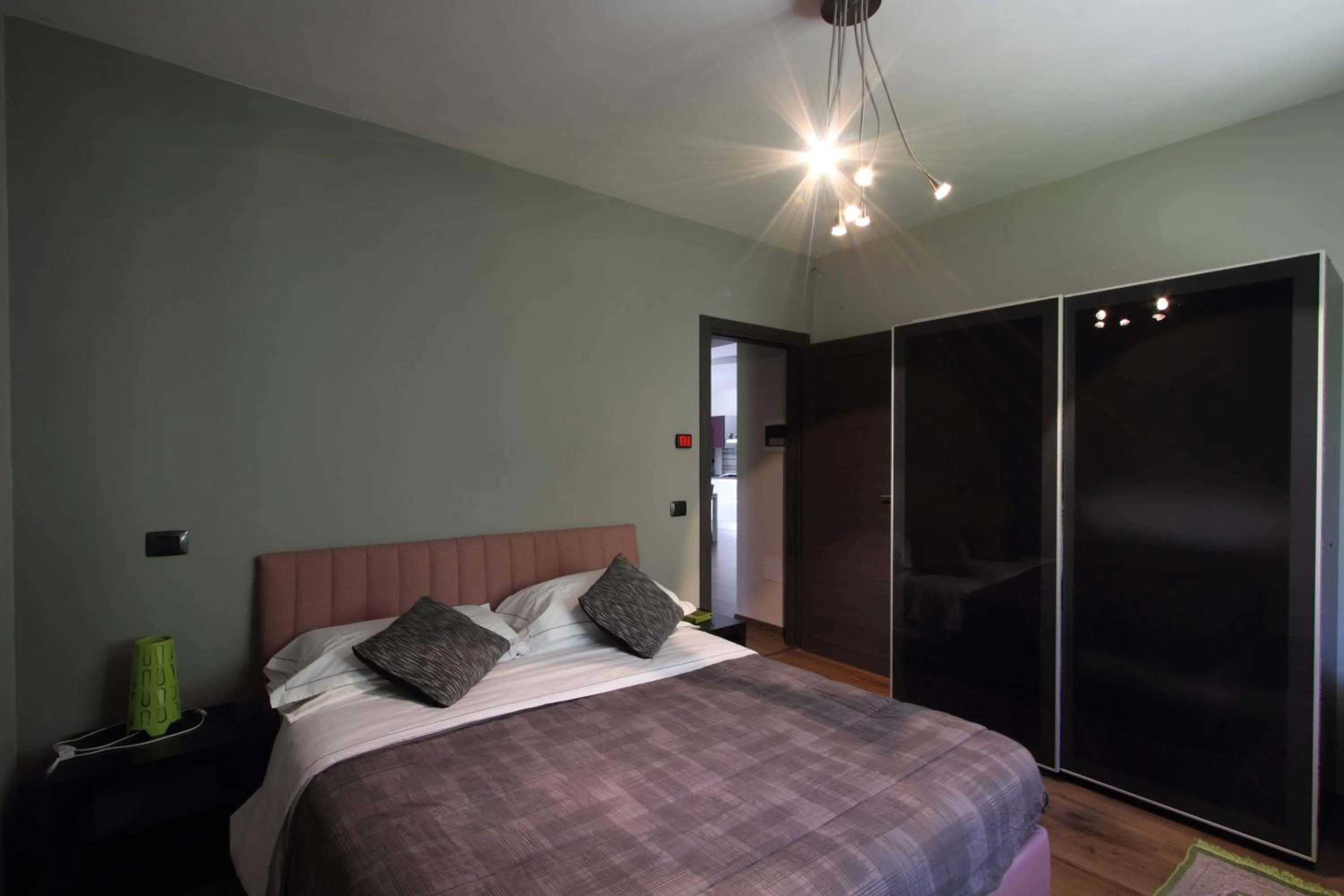 Bed in Il Ruscello Rooms and Luxury Suite