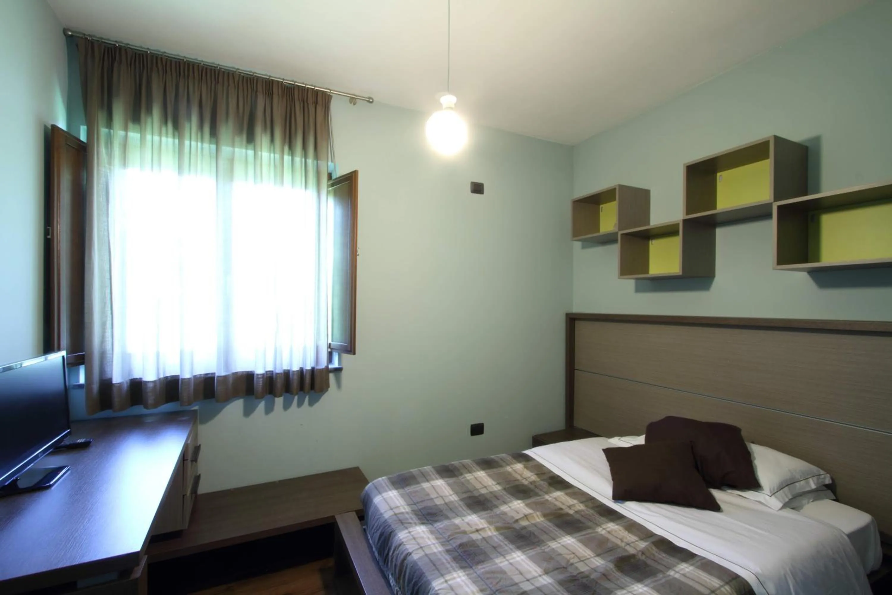 Bed in Il Ruscello Rooms and Luxury Suite