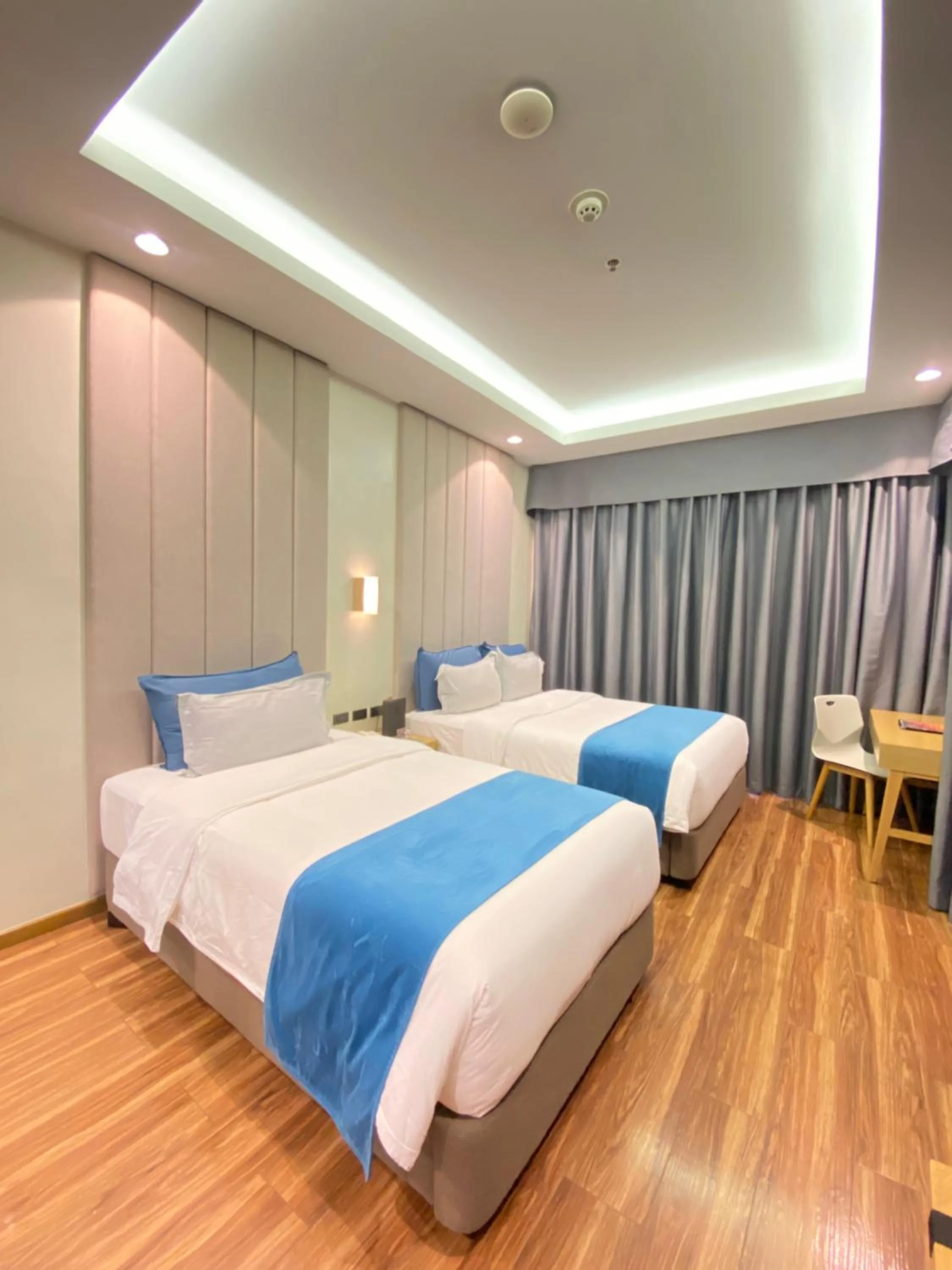 Bed in Bravo Tanauan Hotel