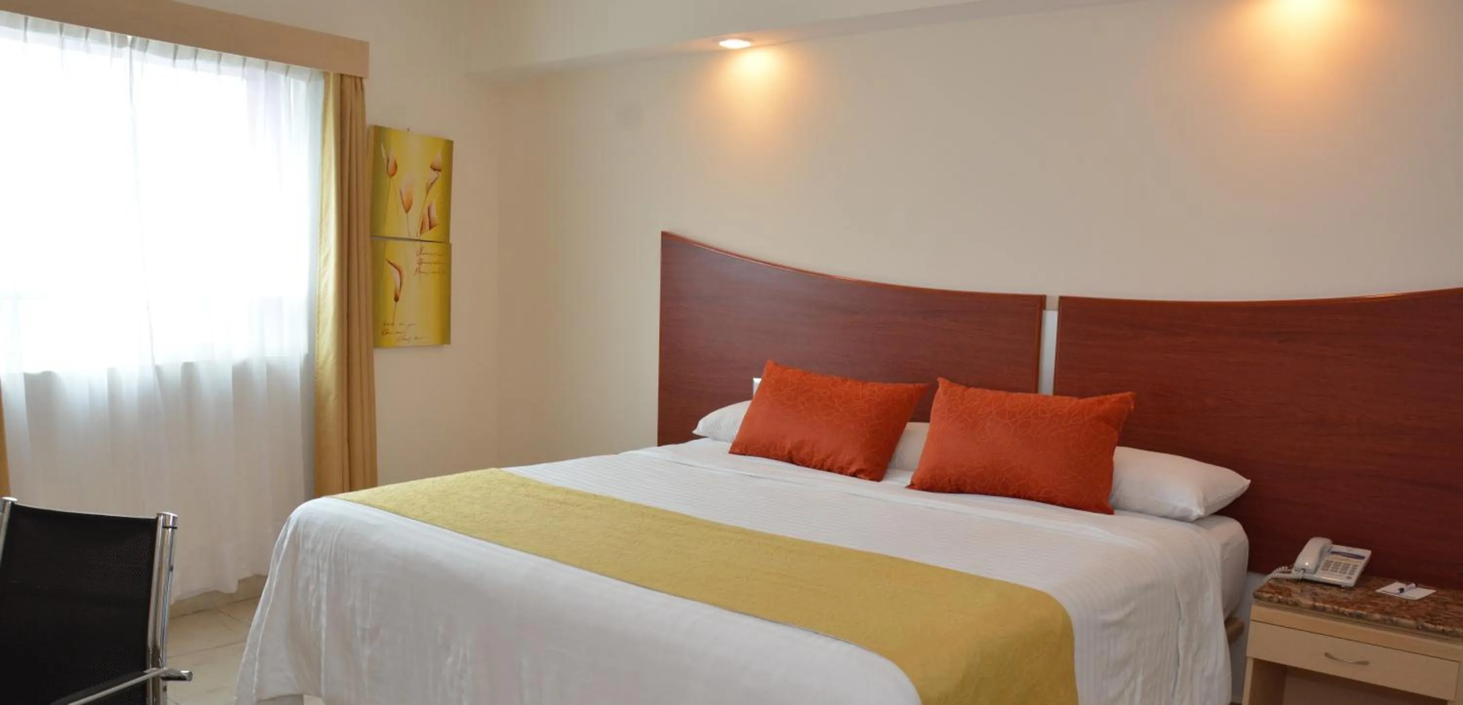 Bed in Hotel Magico Inn