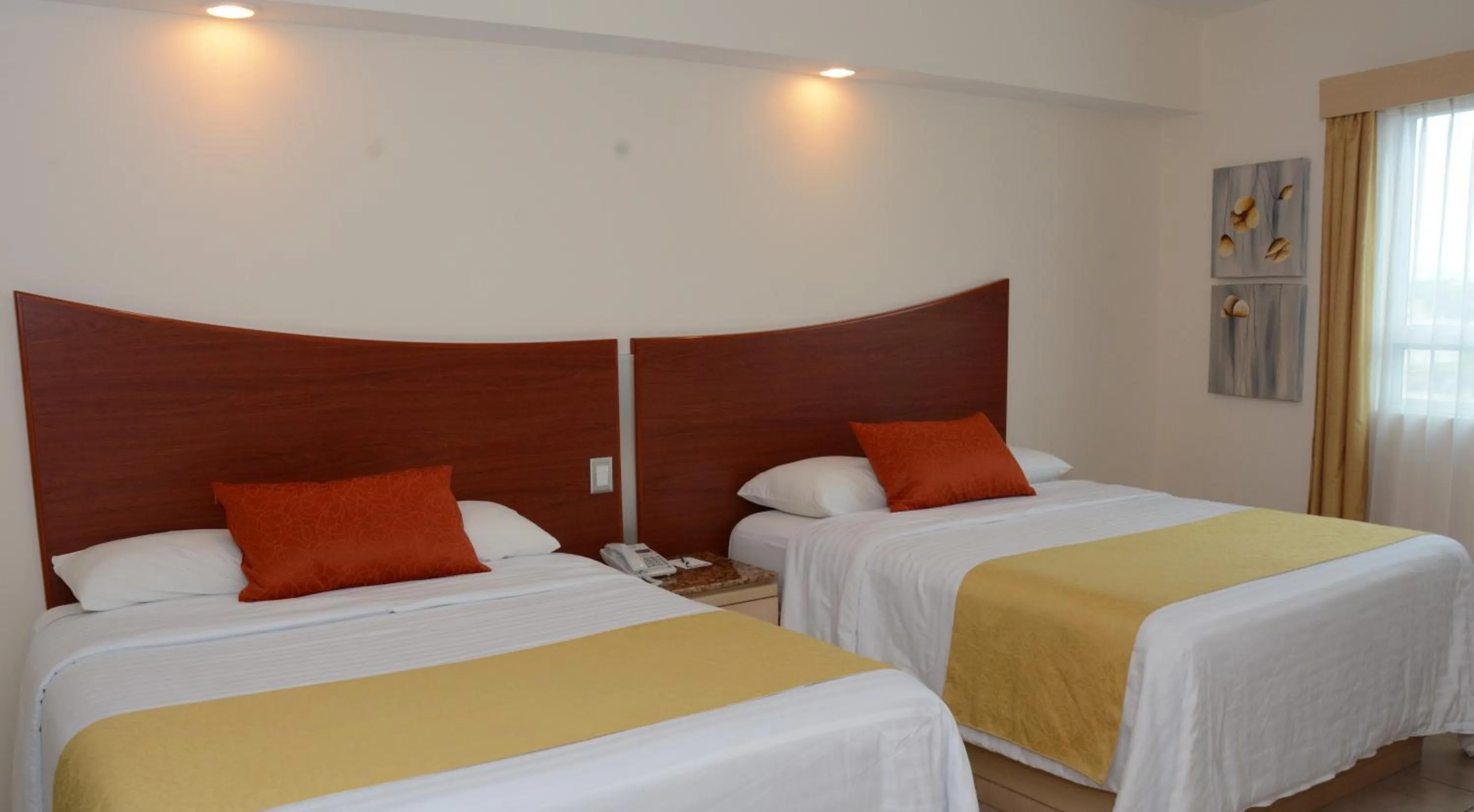 Bed in Hotel Magico Inn