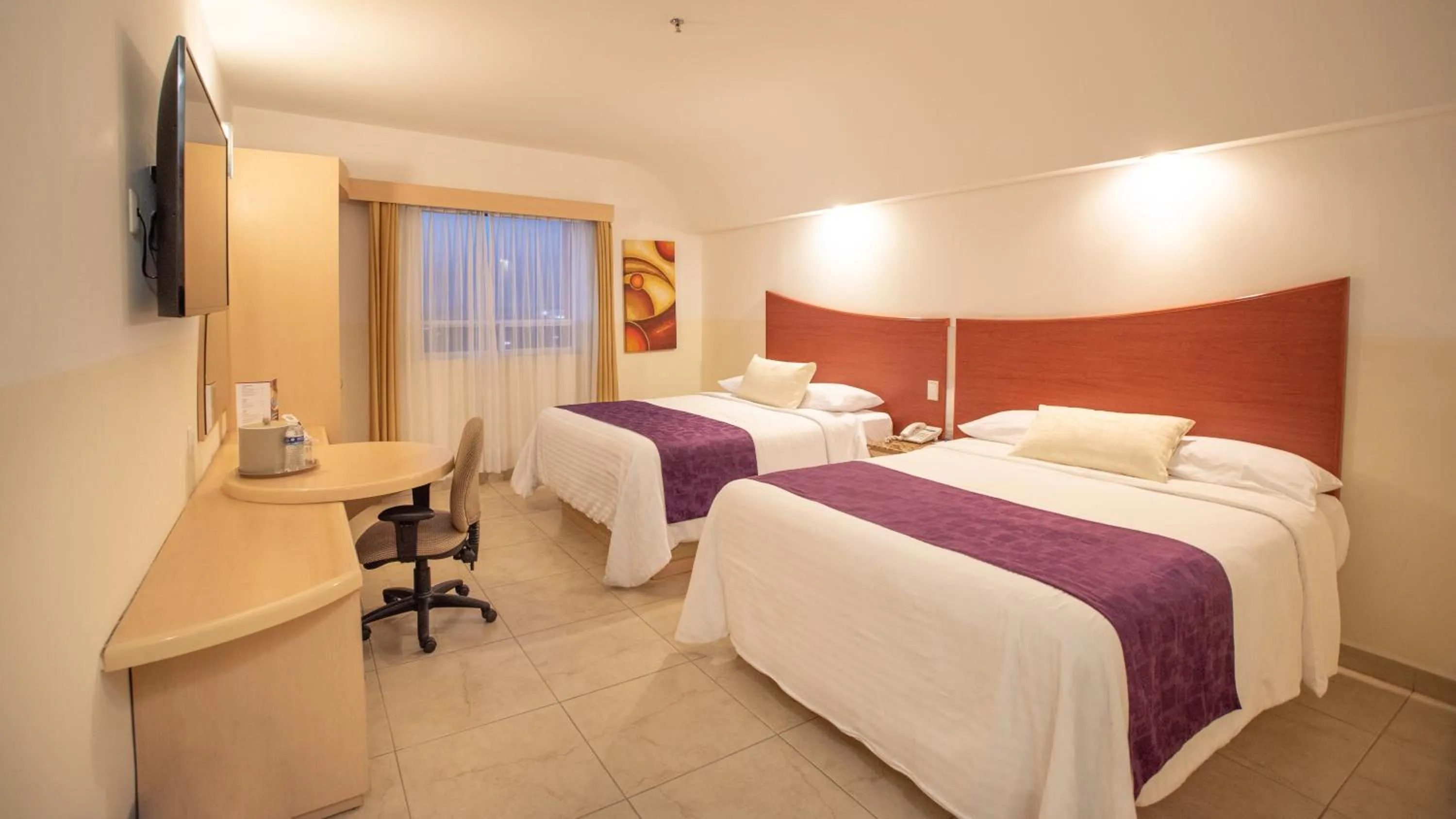 Bed in Hotel Magico Inn