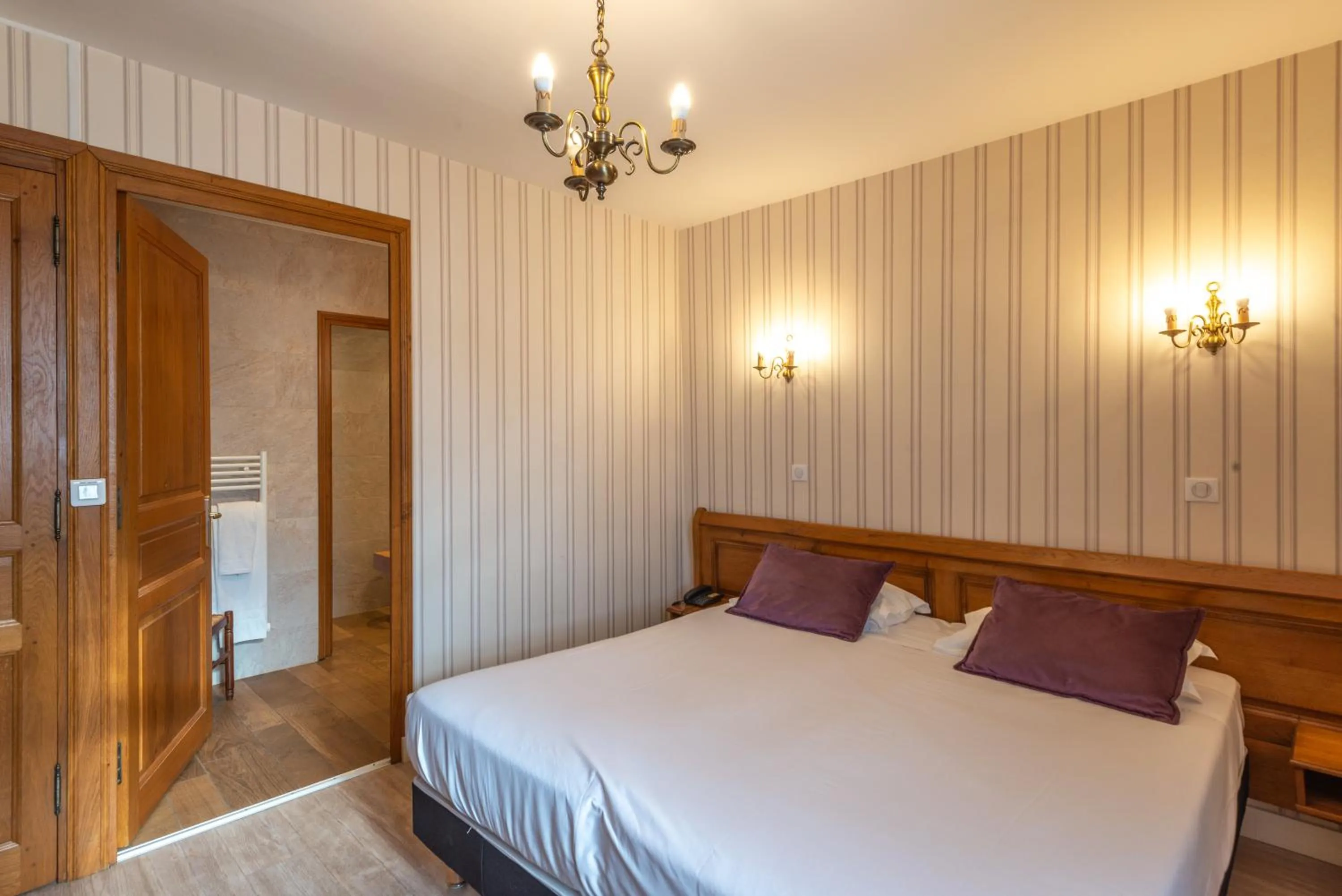 Photo of the whole room, Bed in Logis Hotel de La Cloche