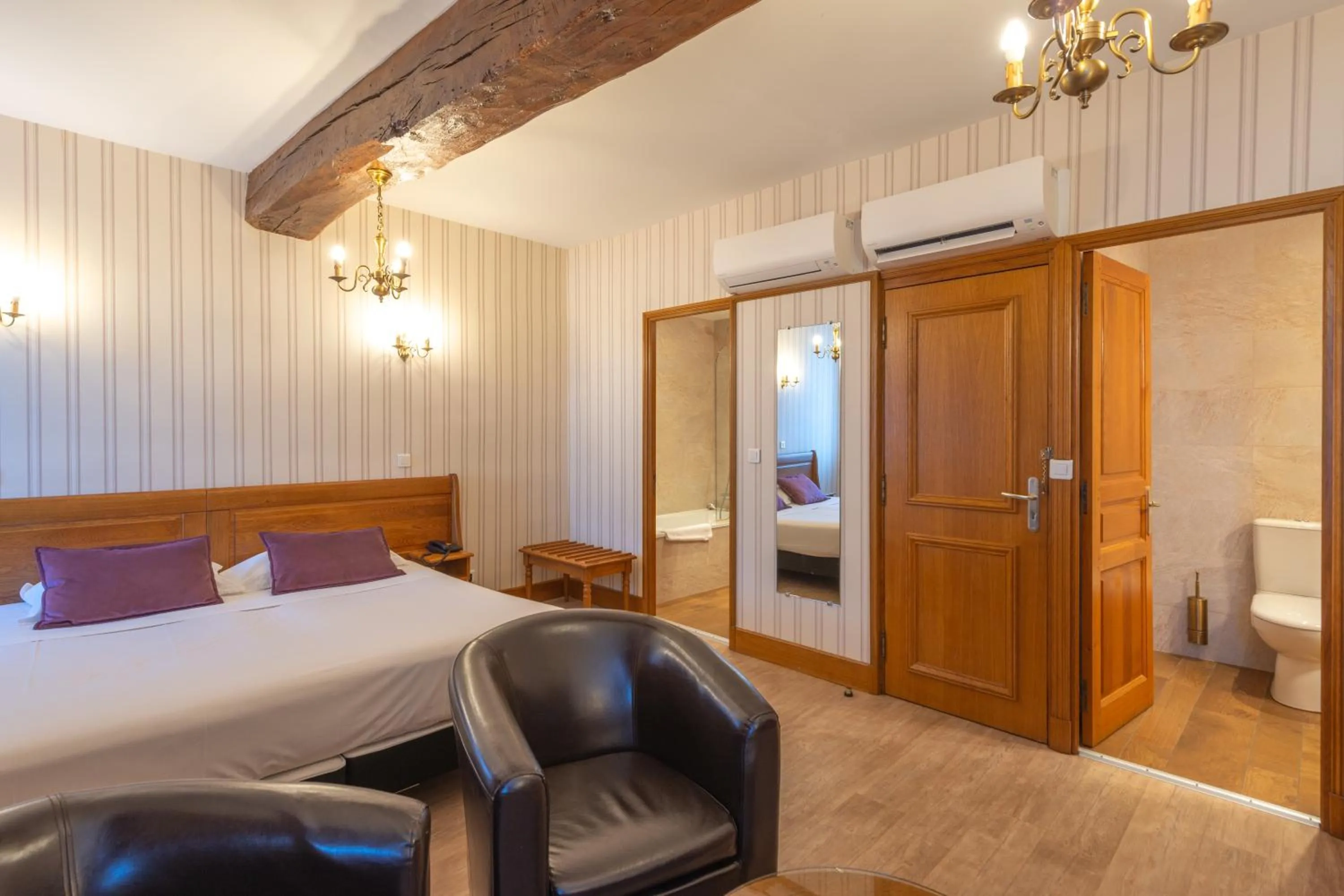 Photo of the whole room, Bed in Logis Hotel de La Cloche