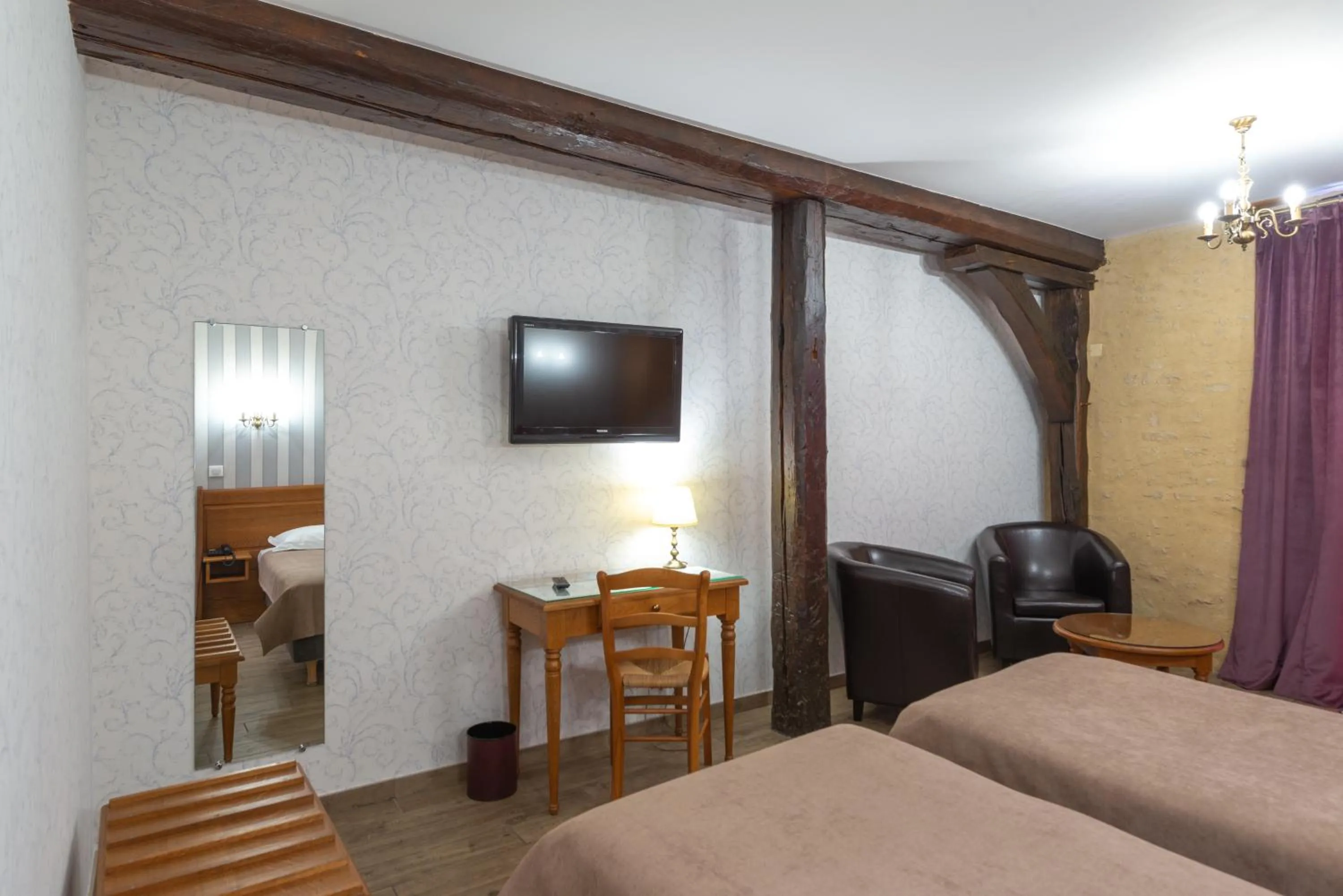 Photo of the whole room, Bed in Logis Hotel de La Cloche
