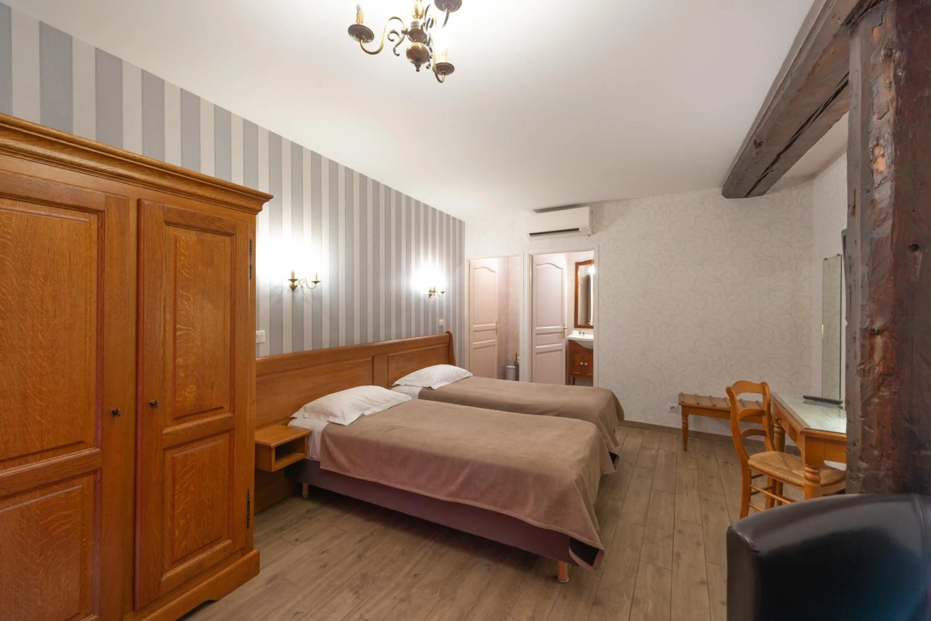 Photo of the whole room, Bed in Logis Hotel de La Cloche