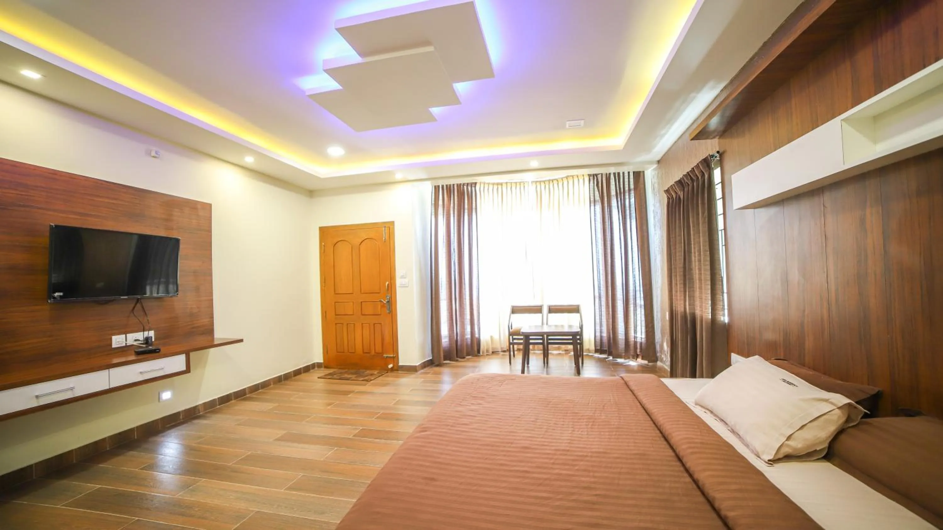 Communal lounge/ TV room, Bed in Aira Residency Kothagiri by Lexstays