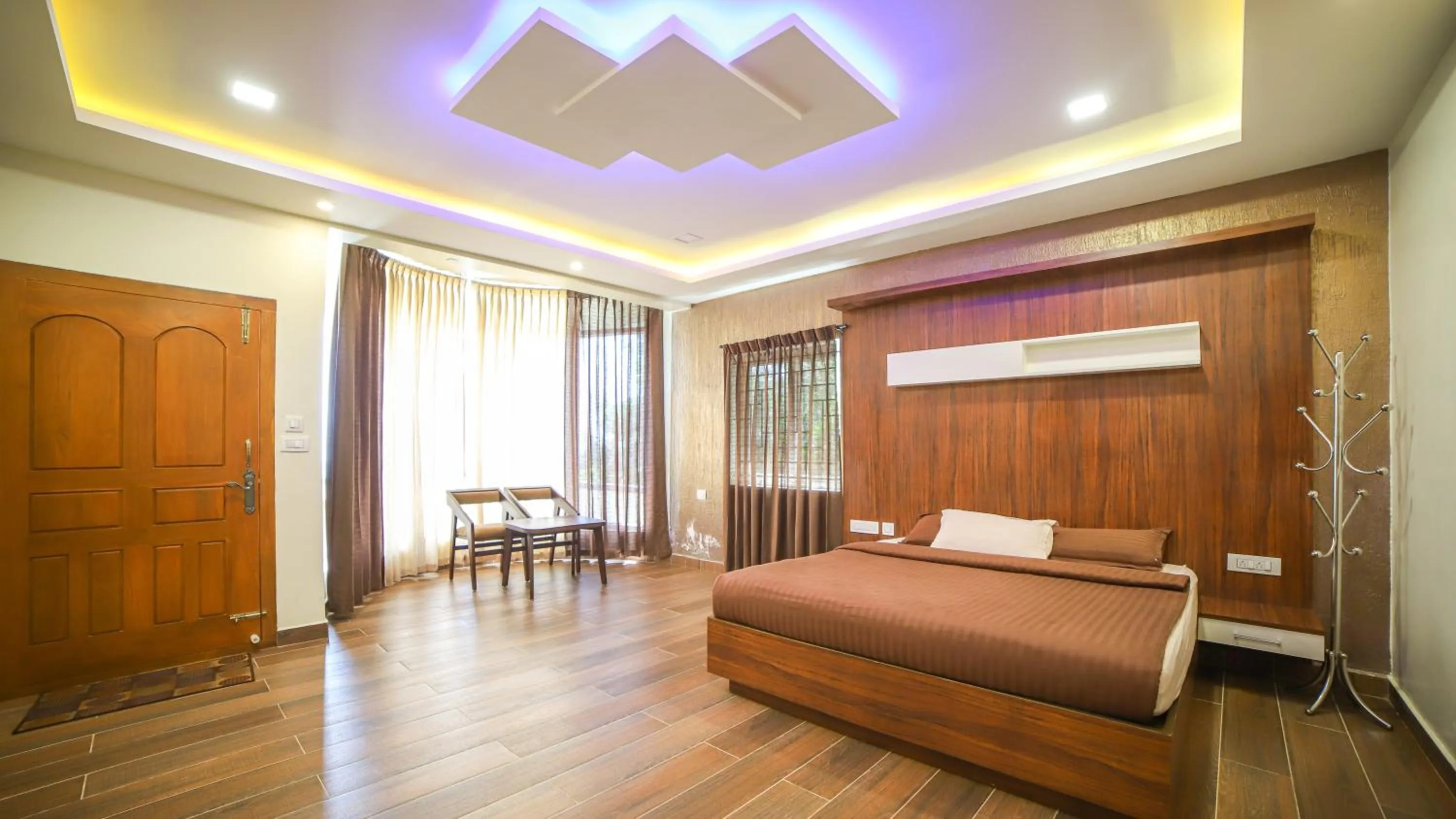 Living room, Bed in Aira Residency Kothagiri by Lexstays