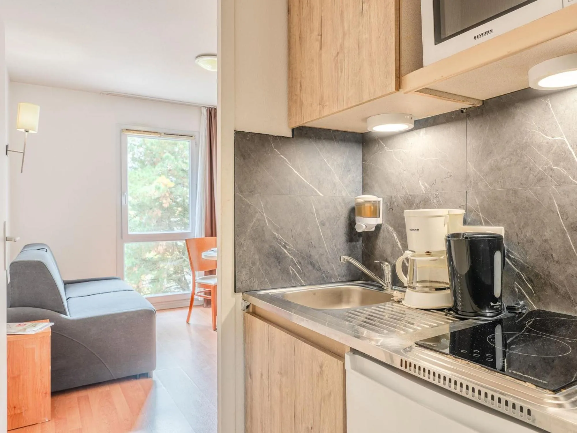 Kitchen or kitchenette in Séjours & Affaires Nantes La Beaujoire