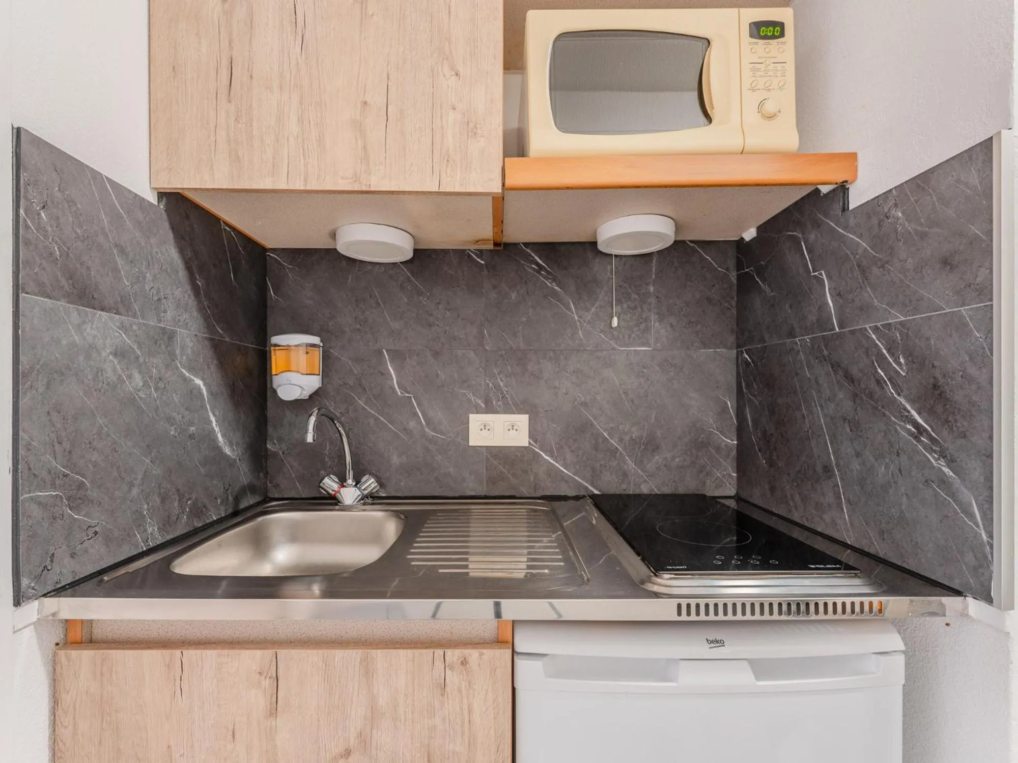 Kitchen or kitchenette in Séjours & Affaires Nantes La Beaujoire